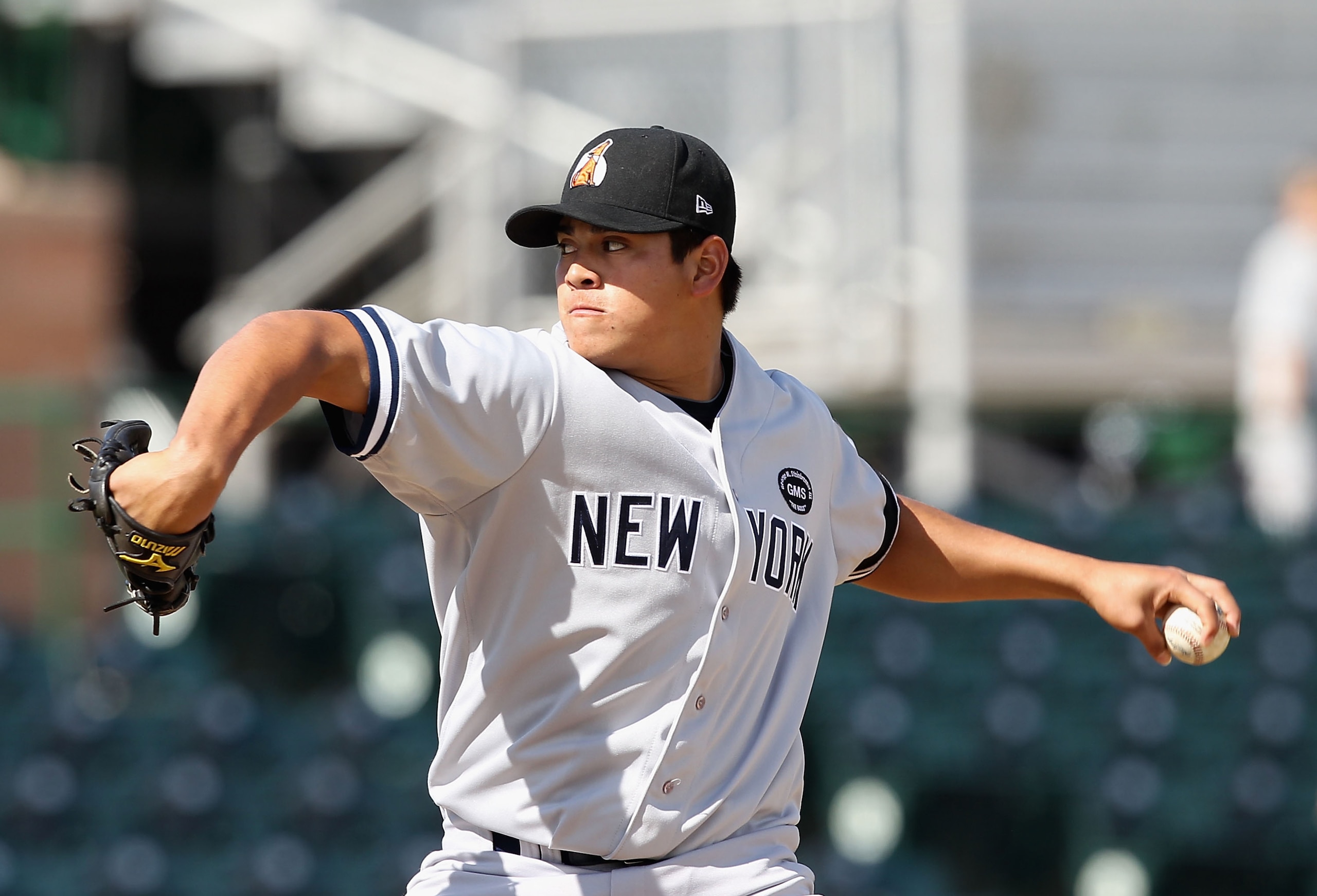 SCOTTSDALE, AZ - OCTOBER 23:  New York Yankees prospect Manuel Banuelos playing for the Phoenix Desert Dogs pitches against the Scottsdale Scorpions during the AZ Fall League game at Scottsdale Stadium on October 23, 2010 in Scottsdale, Arizona.  (Photo b
