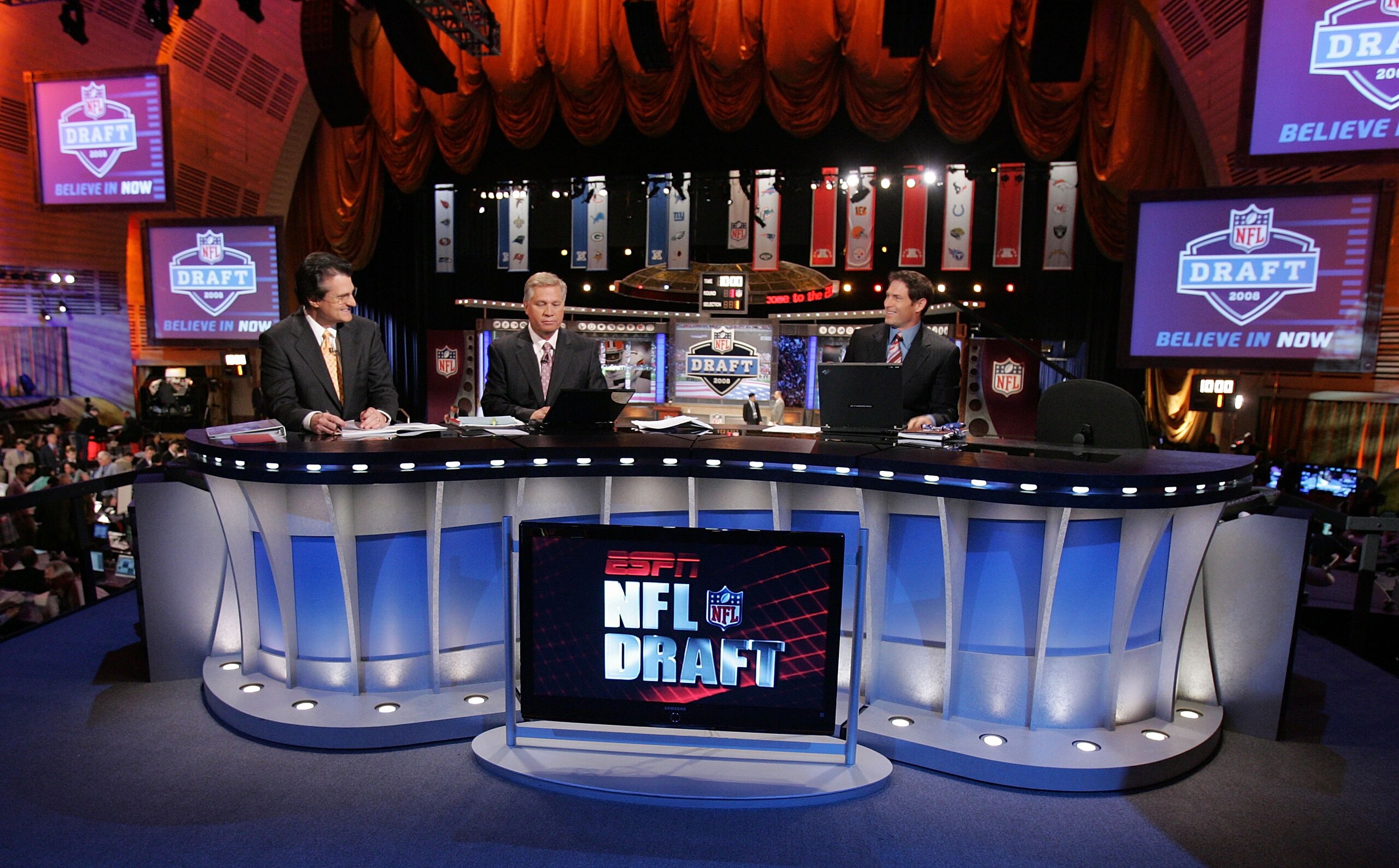 NEW YORK - APRIL 26:  The ESPN broadcast team of (L-R) Mel Kiper, Chris Mortensen, and Steve Young prepare for the 2008 NFL Draft on April 26, 2008 at Radio City Music Hall in New York, New York.  (Photo by Jim McIsaac/Getty Images)