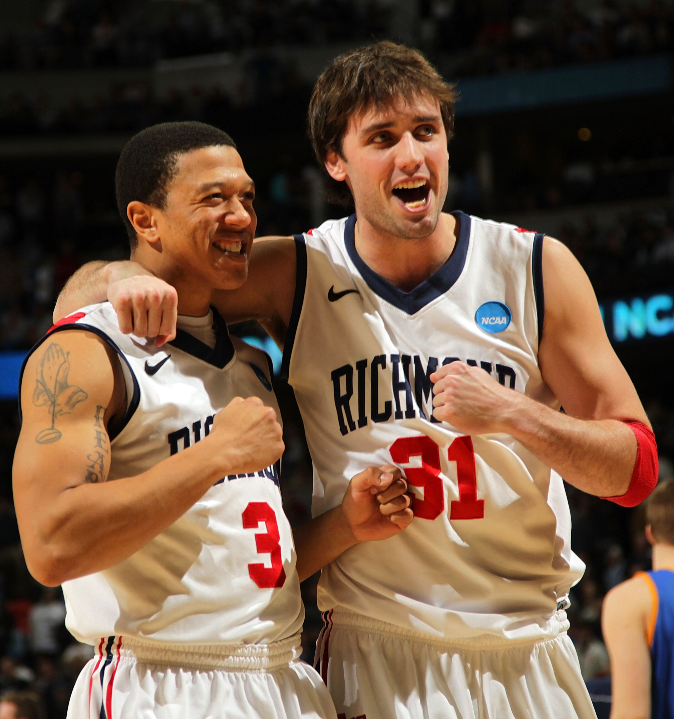 DENVER, CO - MARCH 19:  Darien Brothers #3 and Conor Smith #31 of the Richmond Spiders celebrate after defeating the Morehead State Eagles during the third round of the 2011 NCAA men's basketball tournament at Pepsi Center on March 19, 2011 in Denver, Col