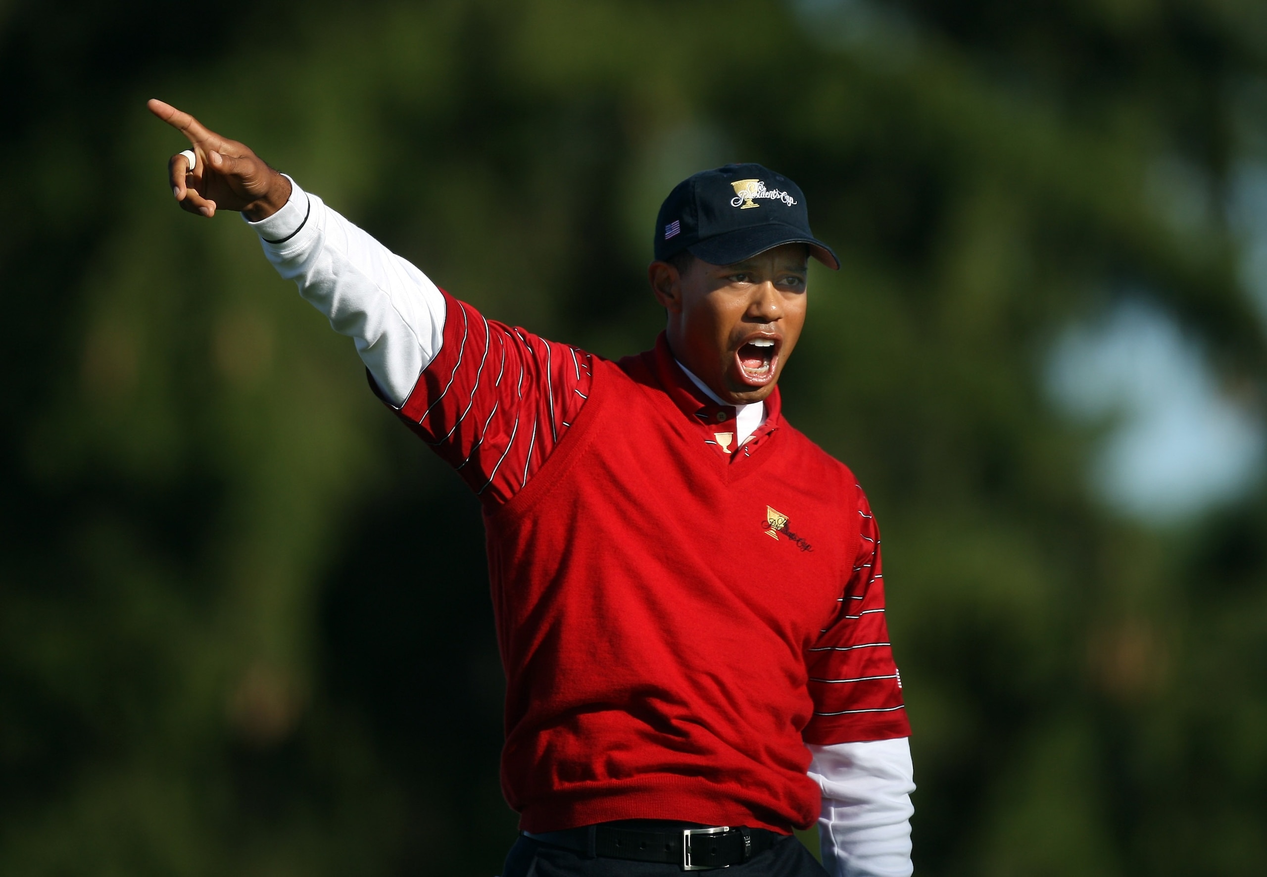 MONTREAL - SEPTEMBER 29:  Tiger Woods of the U.S. Team shouts 'fore' as he hits his tee shot to the ninth hole during the third day morning foursome matches at the Presidents Cup at Royal Montreal Golf Club September 29, 2007 in Montreal, Quebec, Canada.