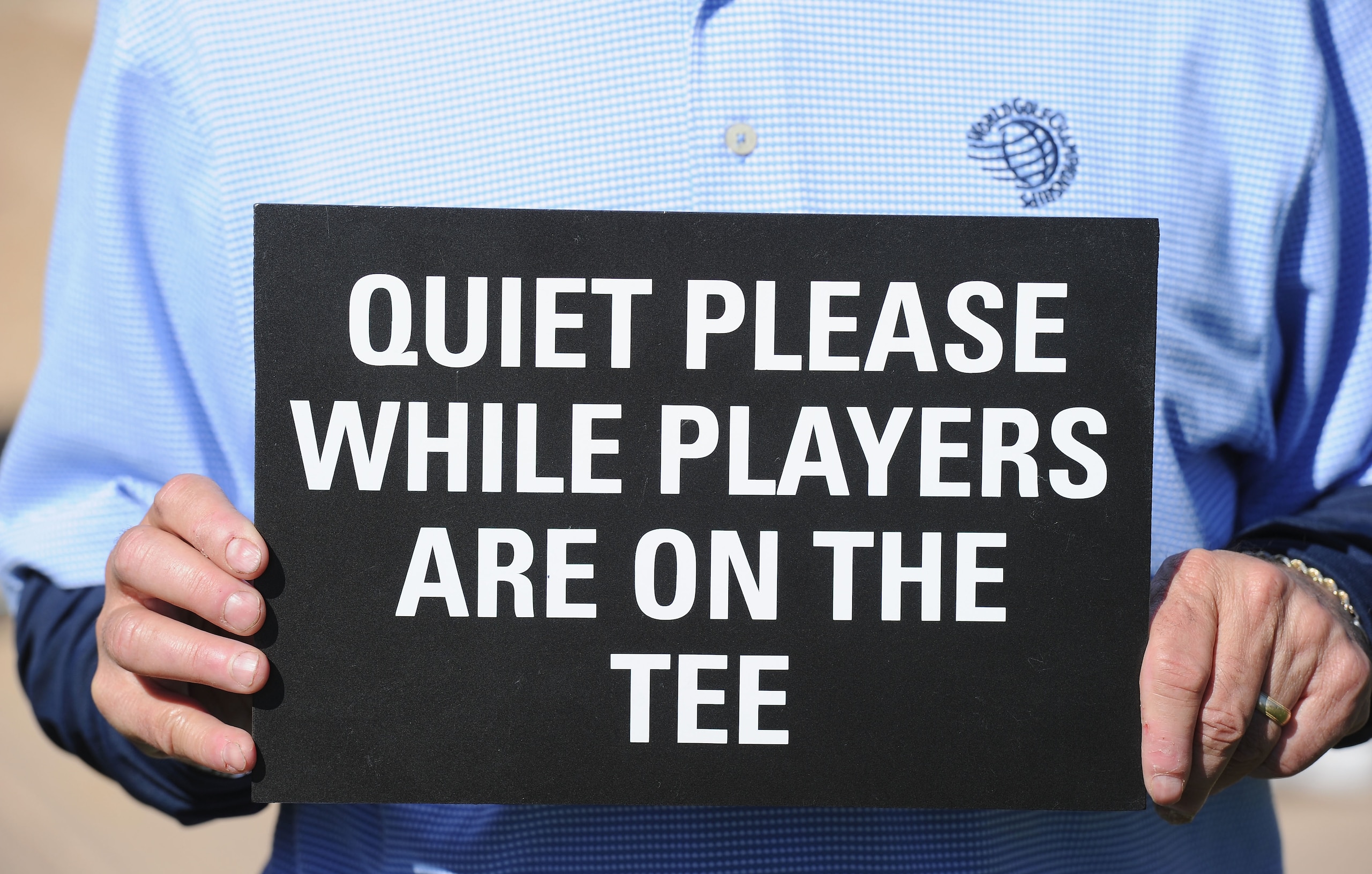 MARANA, AZ - FEBRUARY 24:  A marshall holds a quiet please sign during the second round of the Accenture Match Play Championship at the Ritz-Carlton Golf Club on February 24, 2011 in Marana, Arizona.  (Photo by Stuart Franklin/Getty Images)