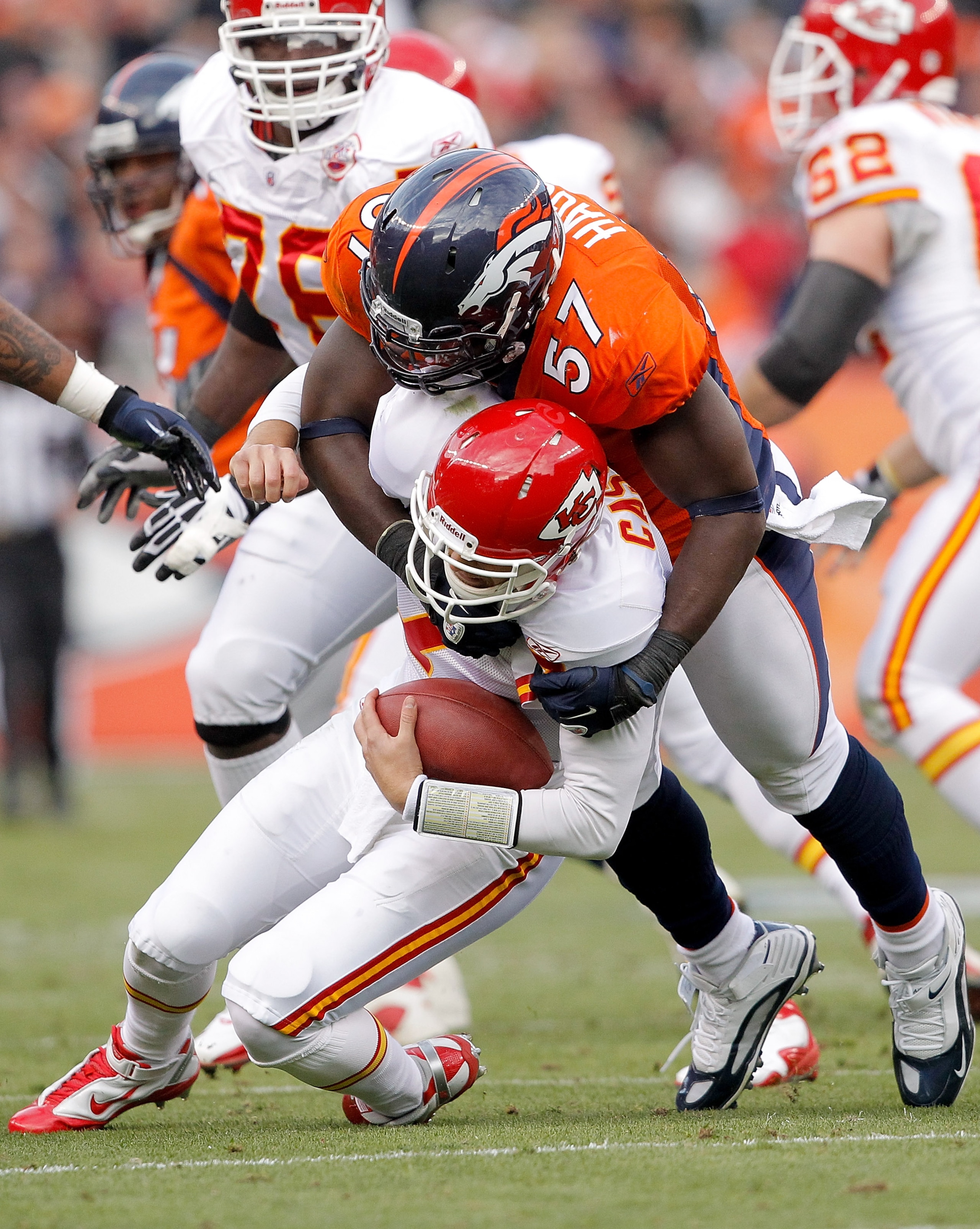DENVER - NOVEMBER 14:  Linebacker Mario Haggan #57 of the Denver Broncos sacks quarterback Matt Cassel #7 of the Kansas City Chiefs during the first quarter at INVESCO Field at Mile High on November 14, 2010 in Denver, Colorado. (Photo by Justin Edmonds/G