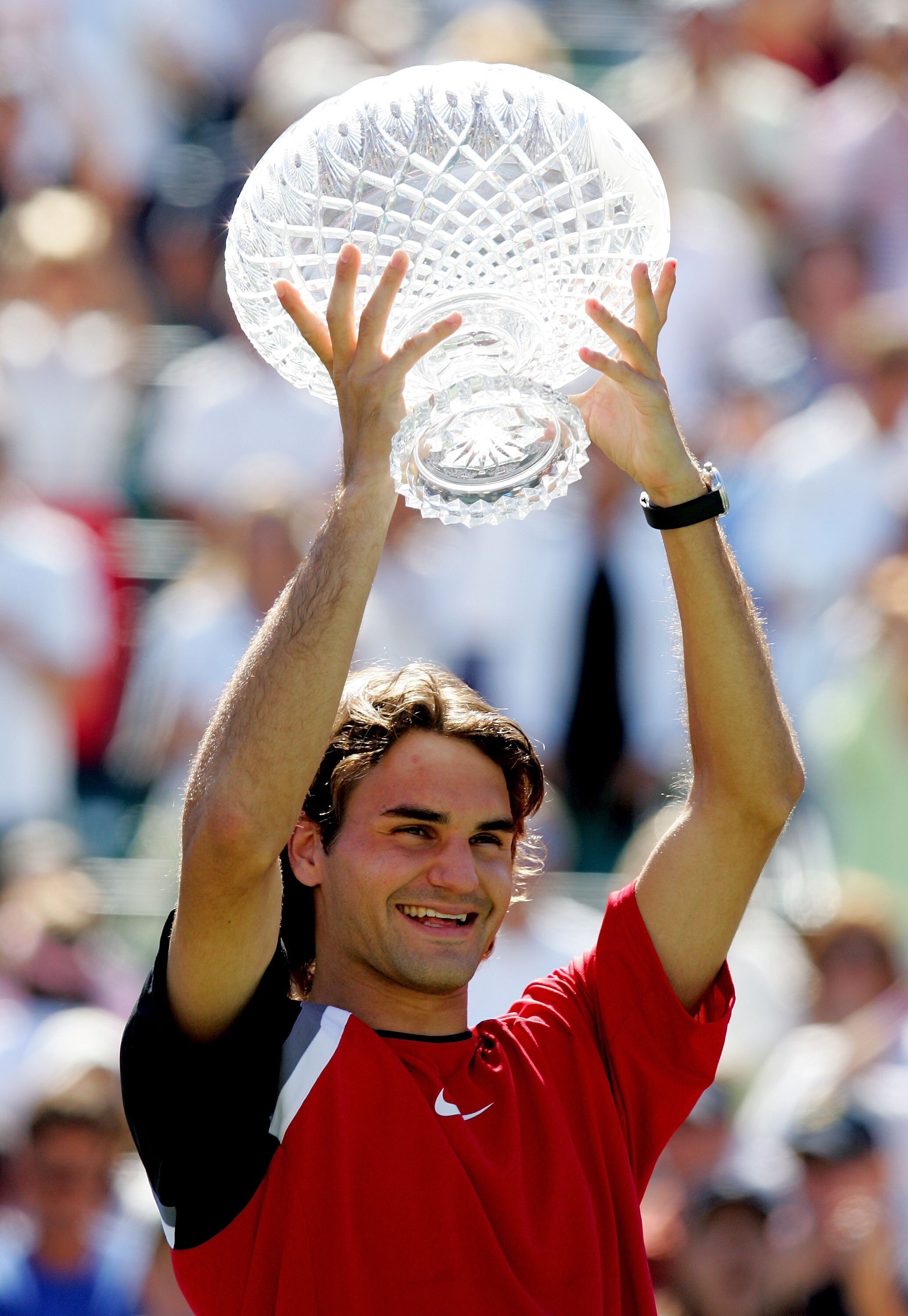 KEY BISCAYNE, FL - APRIL 03:  Roger Federer of Switzerland lifts the trophy after defeating Rafael Nadal of Spain in the men's final during the NASDAQ-100 Open at the Crandon Park Tennis Center on April 3, 2005 in Key Biscayne, Florida.  Federer won the m