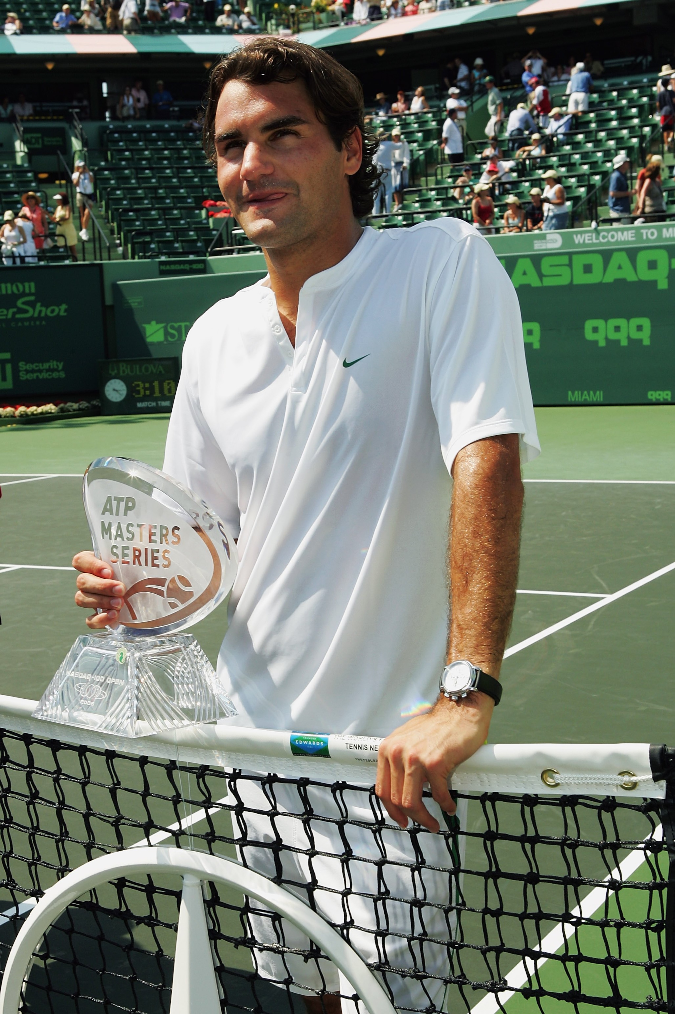 MIAMI - APRIL 02:  Roger Federer of Switzerland holds his Masters Series trophy after winning the men's final by defeating Ivan Ljubicic of Croatia during the Nasdaq-100 Open at the Tennis Center at Crandon Park on April 2, 2006 in Miami, Florida.  Federe