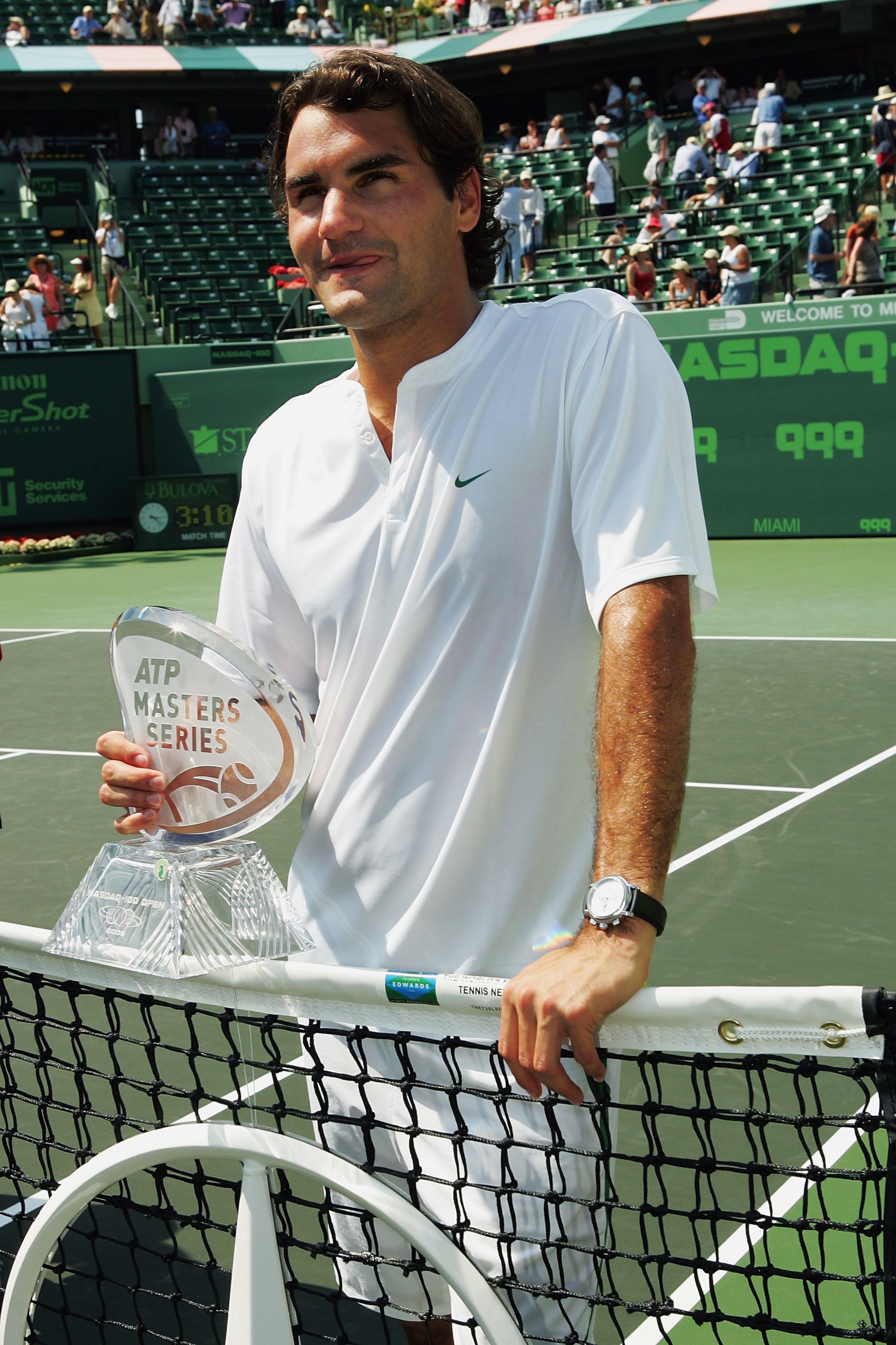 MIAMI - APRIL 02:  Roger Federer of Switzerland holds his Masters Series trophy after winning the men's final by defeating Ivan Ljubicic of Croatia during the Nasdaq-100 Open at the Tennis Center at Crandon Park on April 2, 2006 in Miami, Florida.  Federe