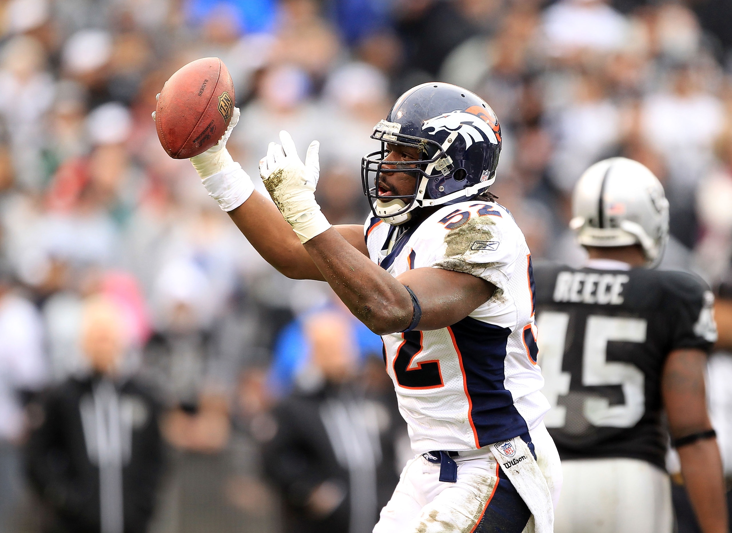 OAKLAND, CA - DECEMBER 19:  Jason Hunter #52 of the Denver Broncos celebrates after he recovered a fumble during their game against the Oakland Raiders at Oakland-Alameda County Coliseum on December 19, 2010 in Oakland, California.  (Photo by Ezra Shaw/Ge