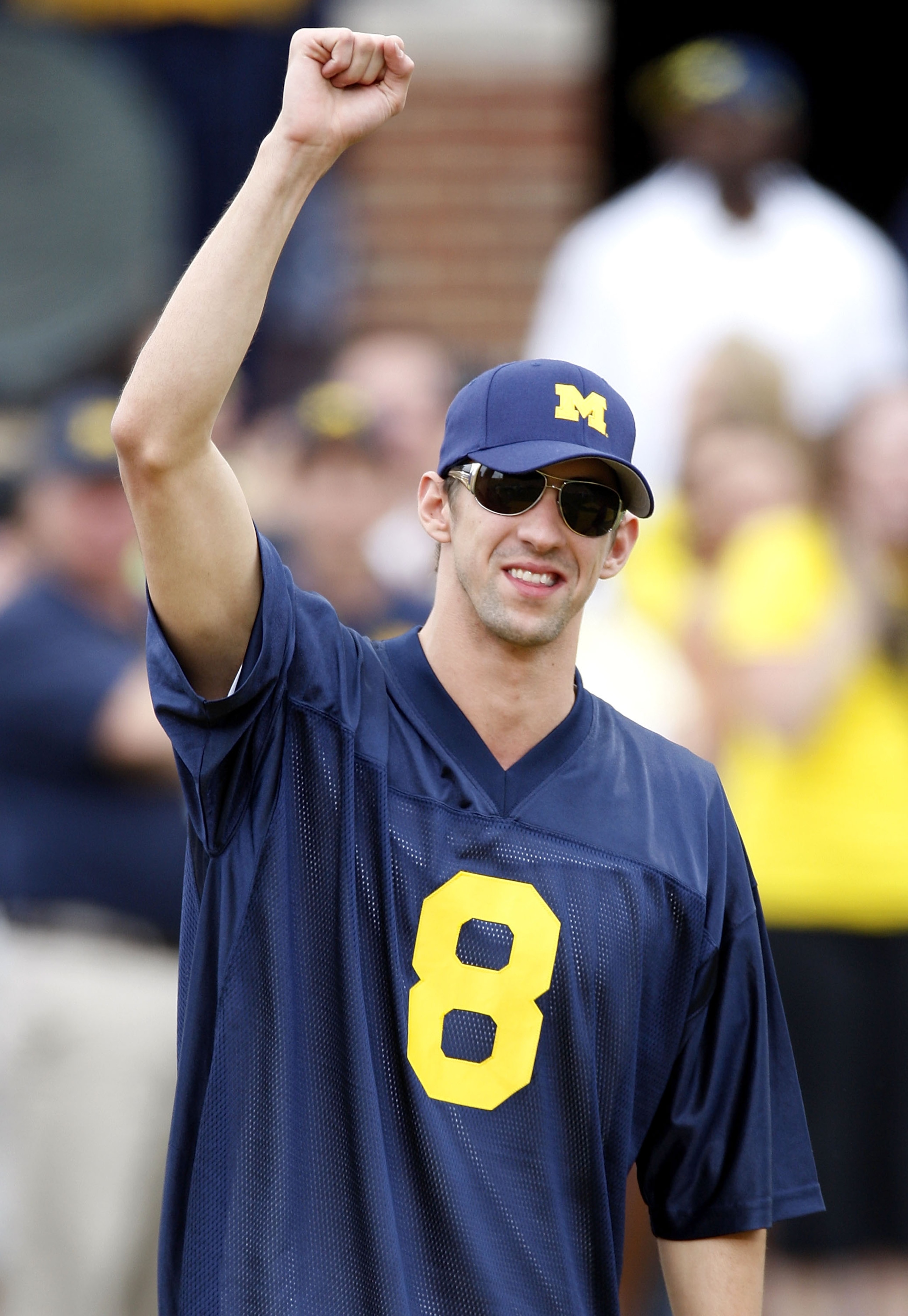 ANN ARBOR, MI - SEPTEMBER 27: 2008 Olympic gold medal winner Michael Phelps is introduced prior to the game between the Wisconsin Badgers and the Michigan Wolverines on September 27, 2008 at Michigan Stadium in Ann Arbor, Michigan. (Photo by Gregory Shamu