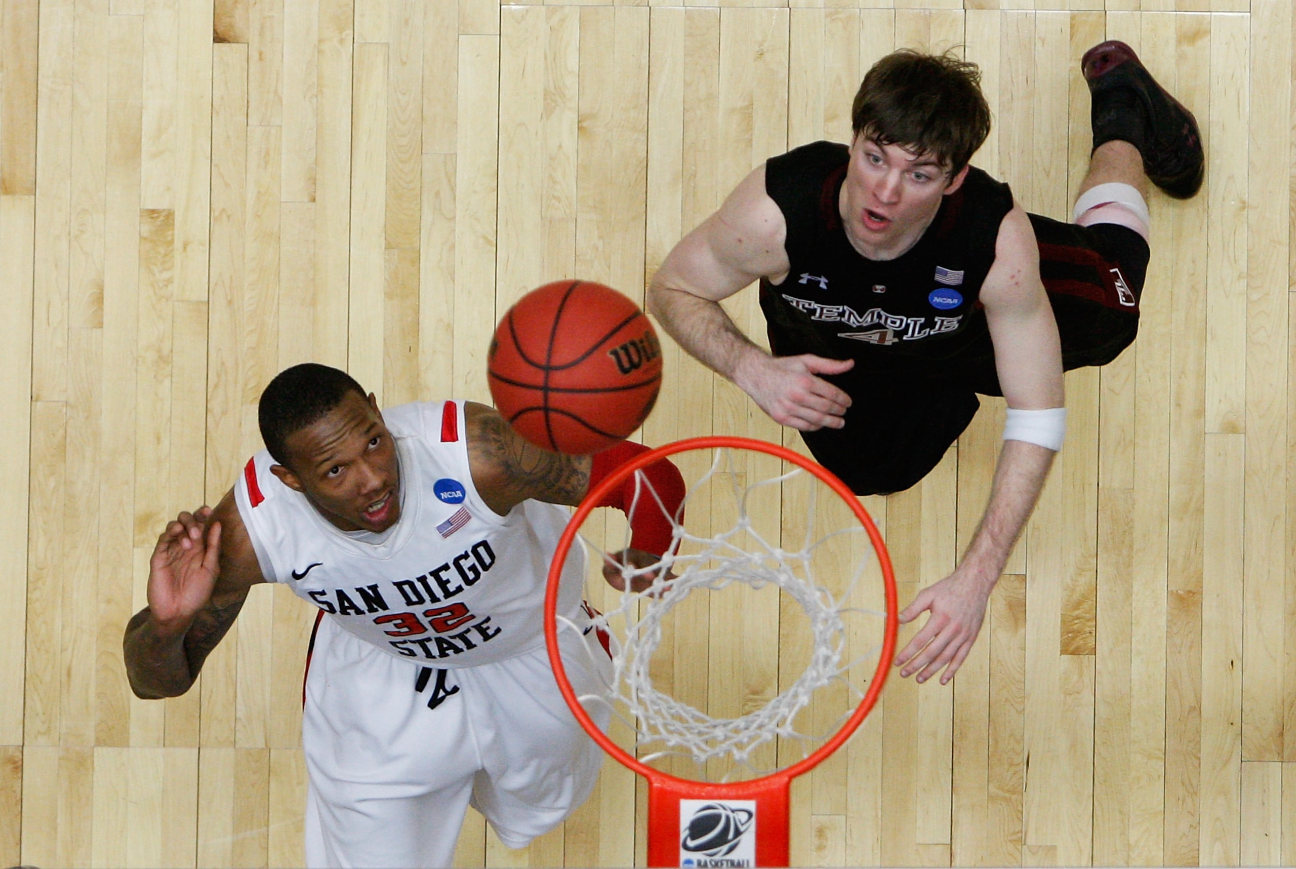 TUCSON, AZ - MARCH 19:  Billy White #32 of the San Diego State Aztecs and Juan Fernandez #4 of the Temple Owls look for a rebound during the third round of the 2011 NCAA men's basketball tournament at McKale Center on March 19, 2011 in Tucson, Arizona.  (