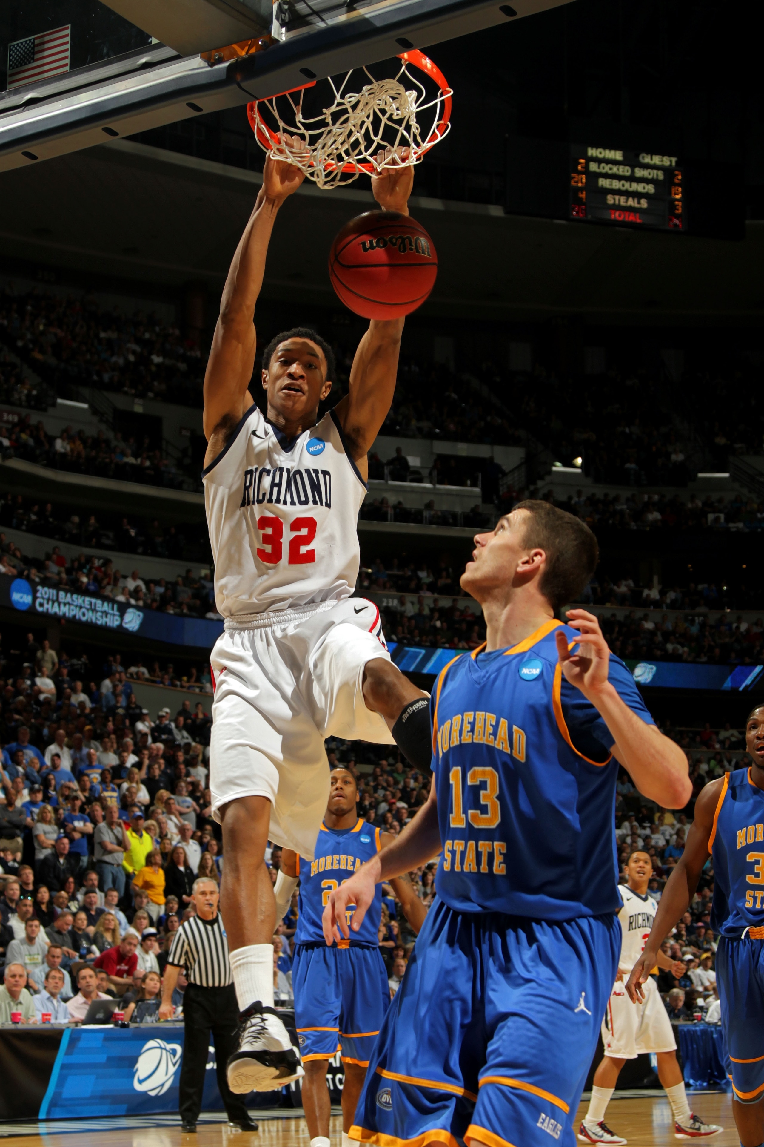 DENVER, CO - MARCH 19:  Justin Harper #32 of the Richmond Spiders dunks the ball against Ty Proffitt #13 of the Morehead State Eagles during the third round of the 2011 NCAA men's basketball tournament at Pepsi Center on March 19, 2011 in Denver, Colorado
