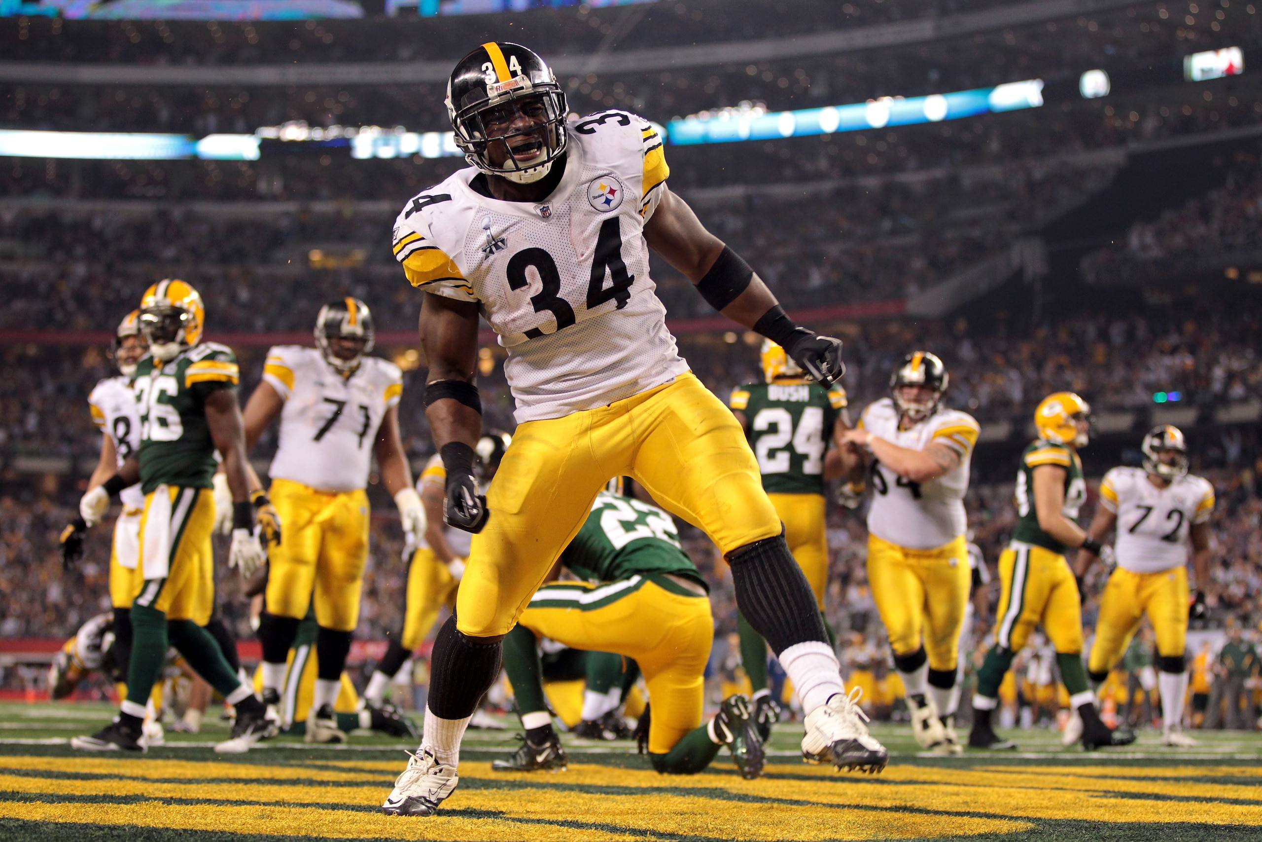 ARLINGTON, TX - FEBRUARY 06: Rashard Mendenhall #34 of the Pittsburgh Steelers celebrates after he scored an 8-yard rushing touchdown against the Green Bay Packers in the second half during Super Bowl XLV at Cowboys Stadium on February 6, 2011 in Arling ARLINGTON, TX - FEBRUARY 06: Rashard Mendenhall #34 of the Pittsburgh Steelers celebrates after he scored an 8-yard rushing touchdown against the Green Bay Packers in the second half during Super Bowl XLV at Cowboys Stadium on February 6, 2011 in Arling
