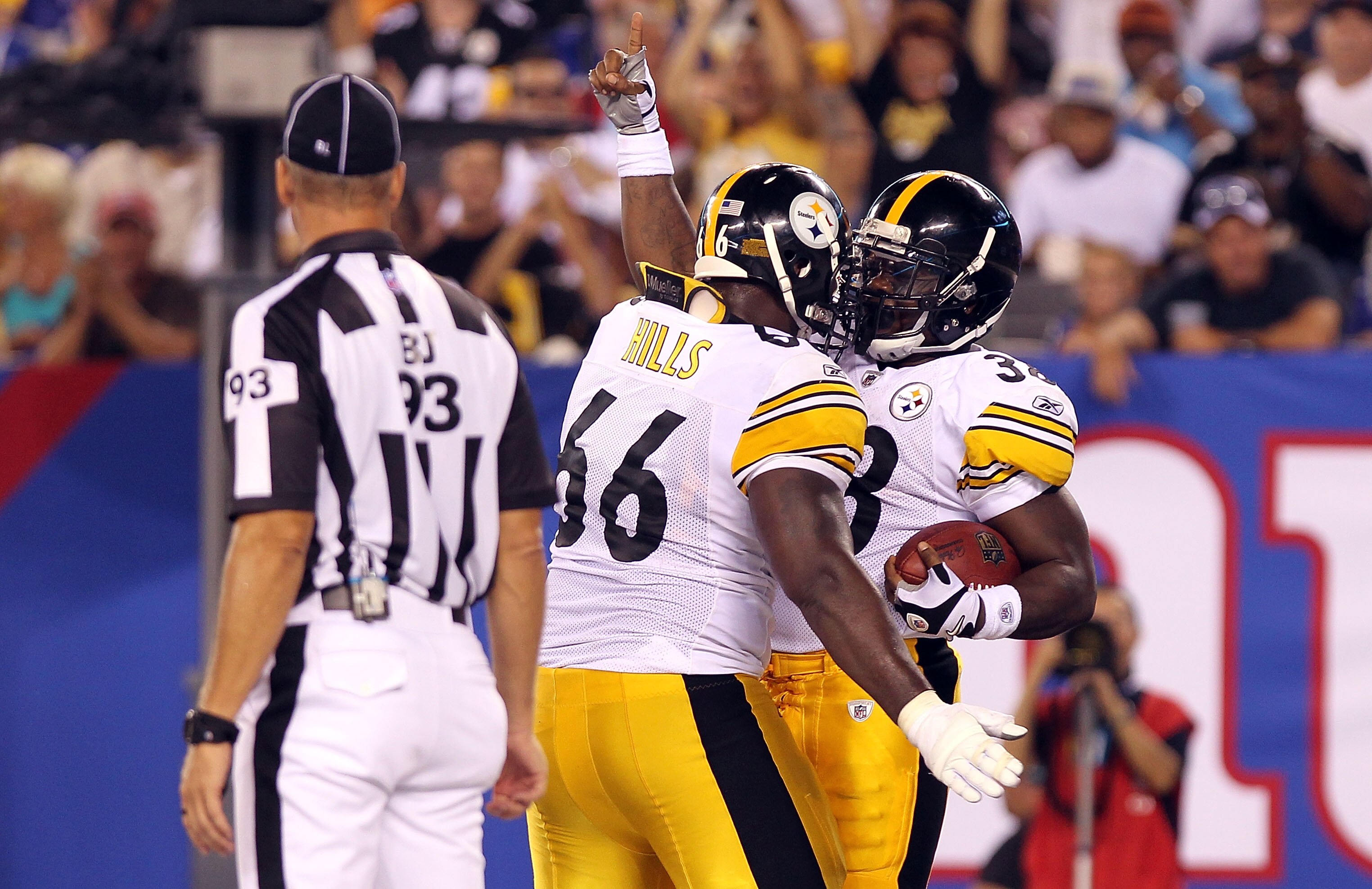 EAST RUTHERFORD, NJ - AUGUST 21:  Dwayne Wright #38 of the Pittsburgh Steelers celebrates his touchdown with teammate Tony Hills #66 against the New York Giants during their preseason game at New Meadowlands Stadium on August 21, 2010 in East Rutherford,