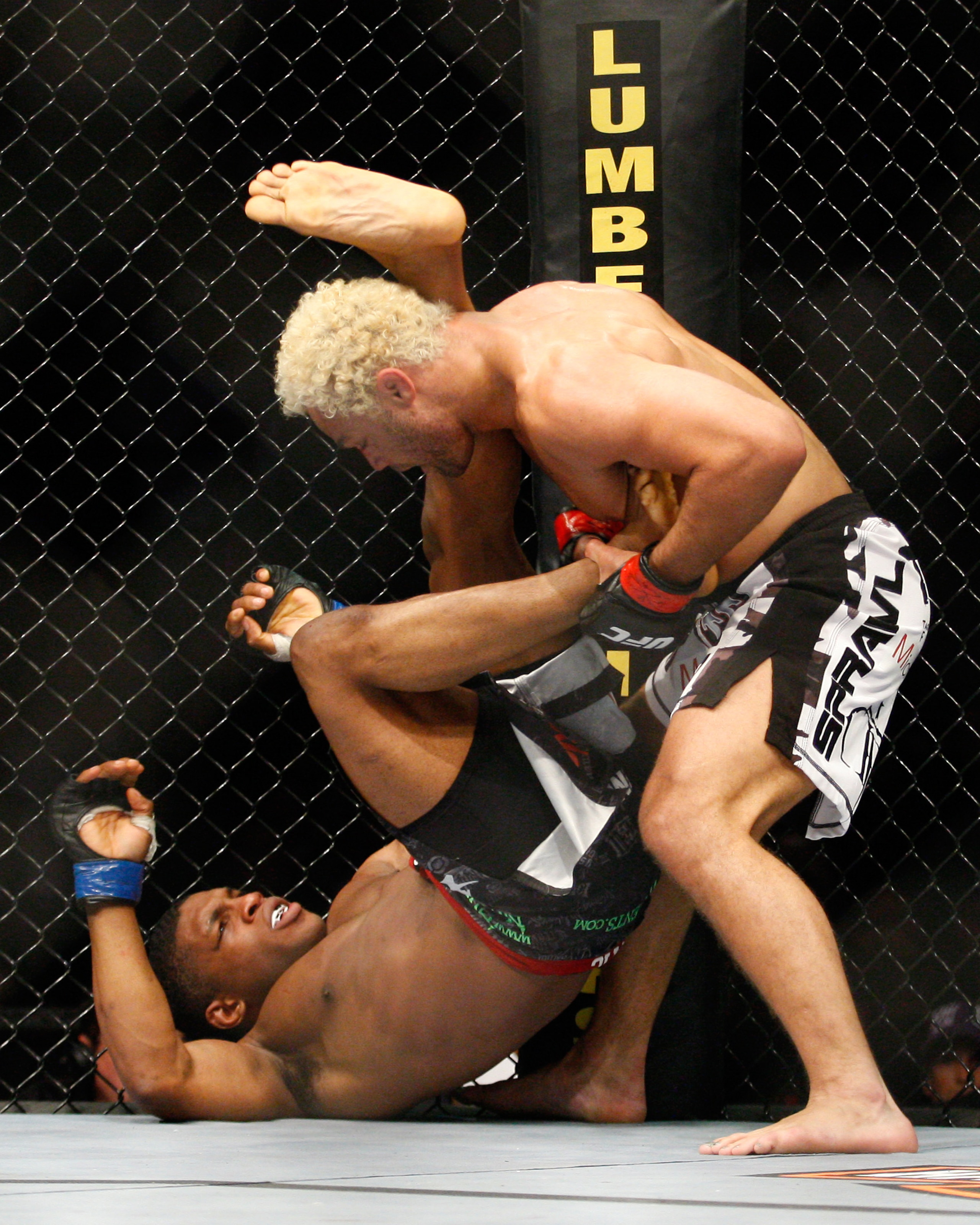 MONTREAL- MAY 8: Josh Koscheck (R) pulls the leg of Paul Daley in their welter weight bout at UFC 113 at Bell Centre on May 8, 2010 in Montreal, Quebec, Canada.  (Photo by Richard Wolowicz/Getty Images)