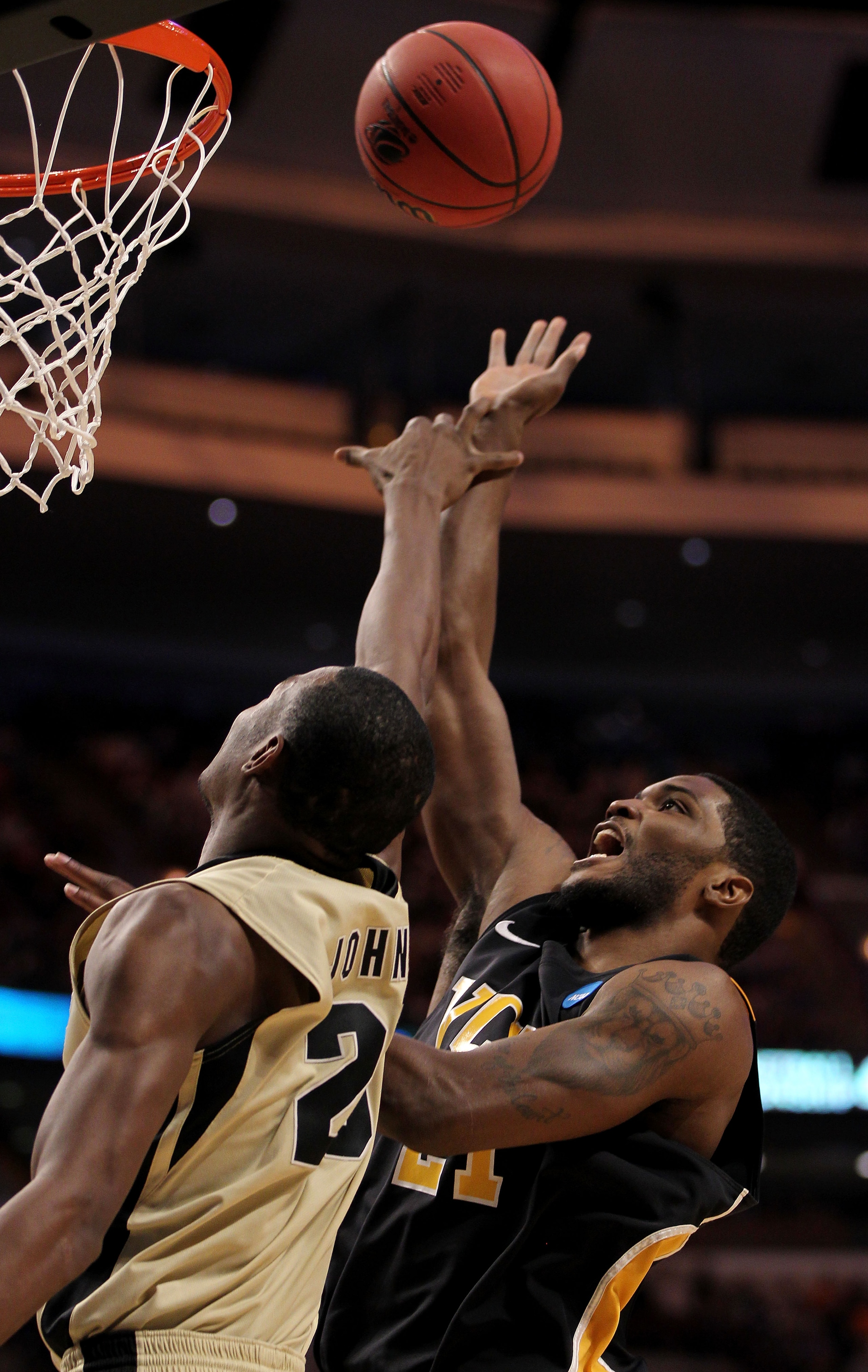 CHICAGO, IL - MARCH 20:  Jamie Skeen #21 of the Virginia Commonwealth Rams shoots against JaJuan Johnson #25 of the Purdue Boilermakers  in the first half during the third round of the 2011 NCAA men's basketball tournament at the United Center on March 20