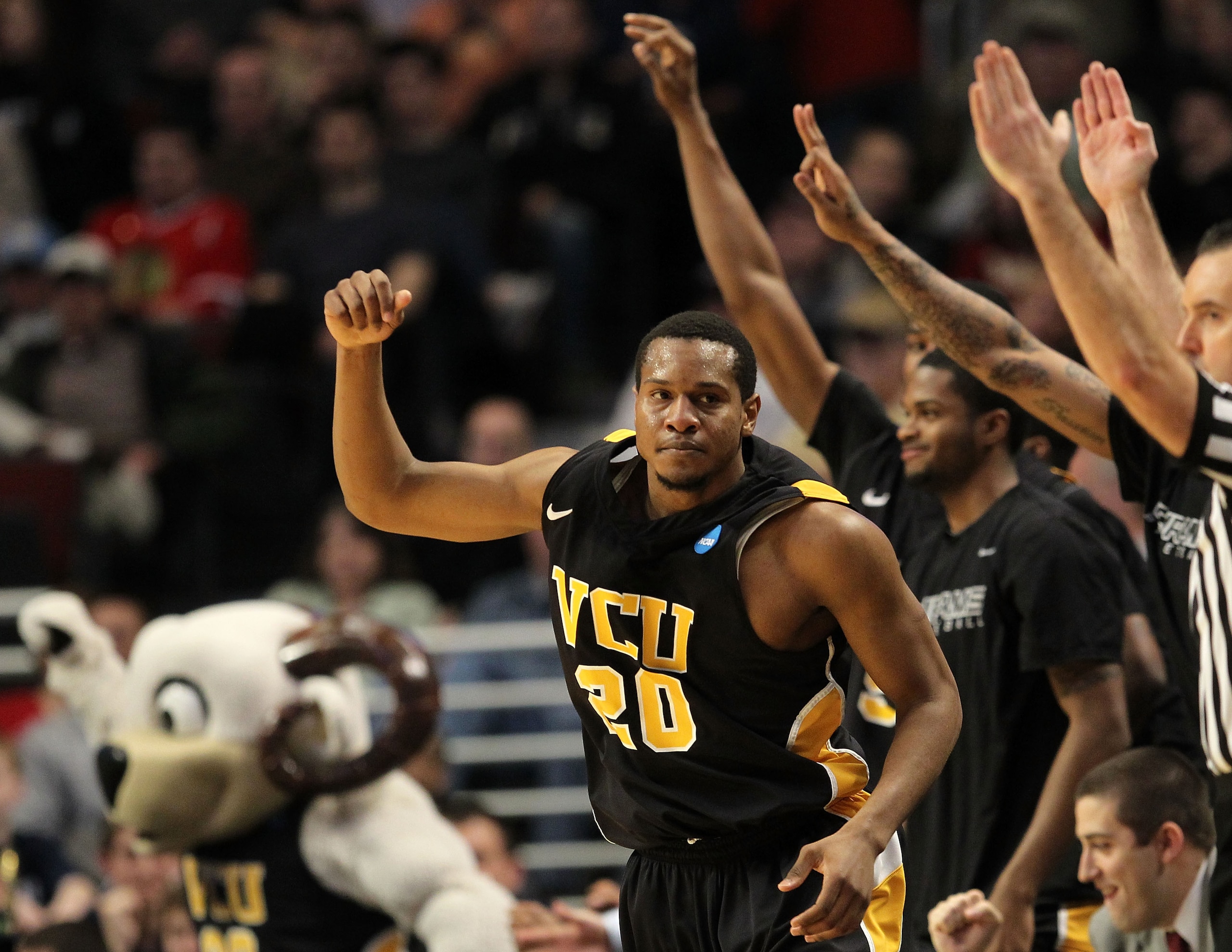 CHICAGO, IL - MARCH 20:  Bradford Burgess #20 of the Virginia Commonwealth Rams celebrates in the second half of the game against the Purdue Boilermakers during the third round of the 2011 NCAA men's basketball tournament at the United Center on March 20,