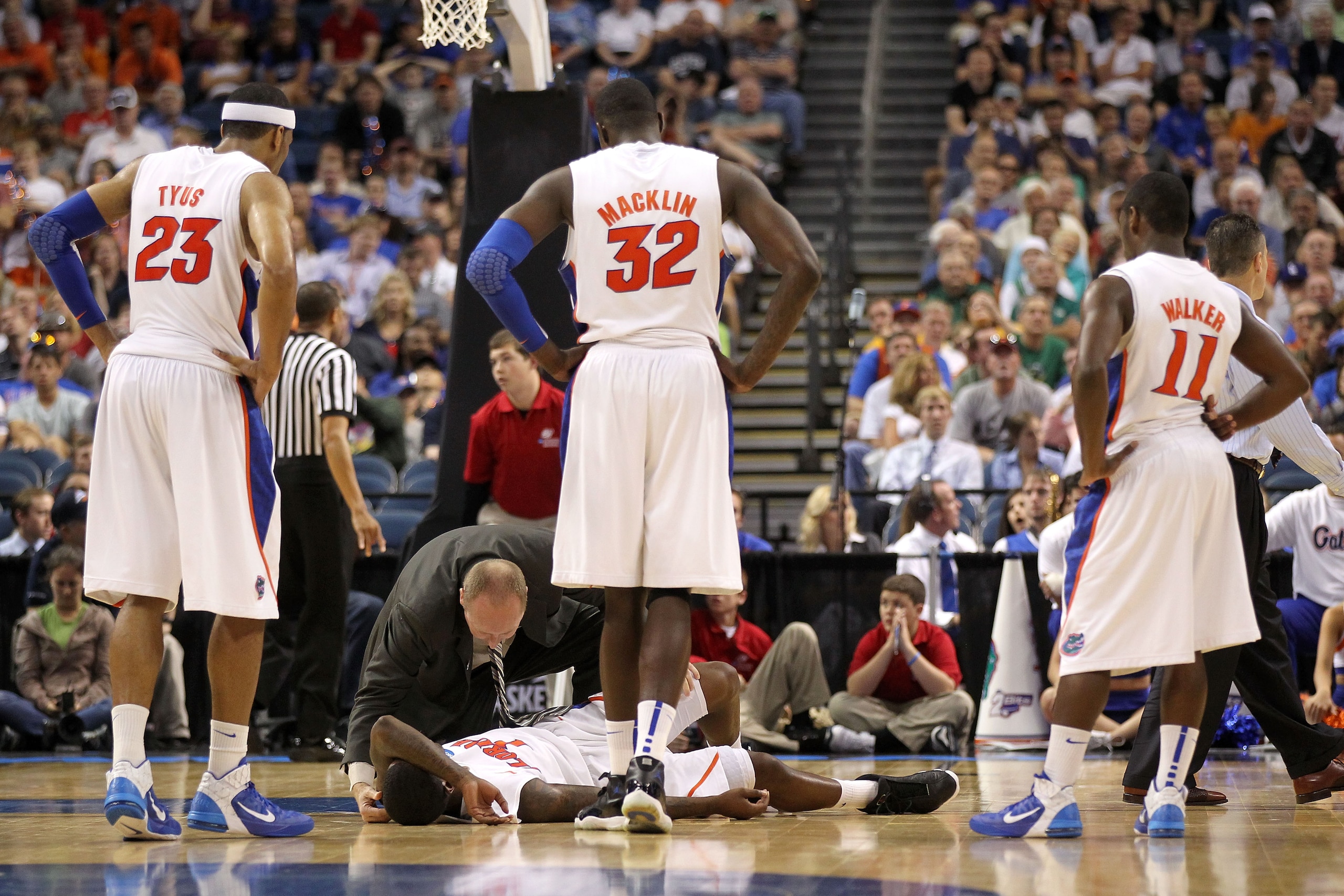 TAMPA, FL - MARCH 19:  Kenny Boynton #1 of the Florida Gators is tended to a trainer after he got hurt against the UCLA Bruins during the third round of the 2011 NCAA men's basketball tournament at St. Pete Times Forum on March 19, 2011 in Tampa, Florida.