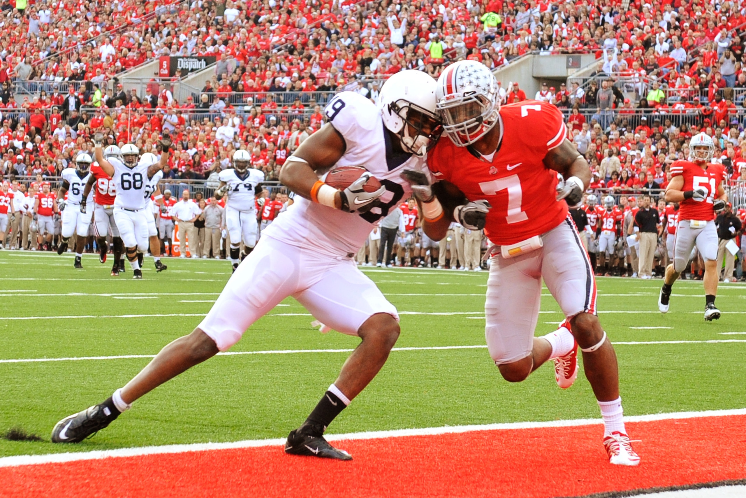 COLUMBUS, OH - NOVEMBER 13:  Justin Brown #19 of the Penn State Nittany Lions scores on a 23-yard pass reception in the first quarter as Jermale Hines #7 of the Ohio State Buckeyes defends at Ohio Stadium on November 13, 2010 in Columbus, Ohio.  (Photo by