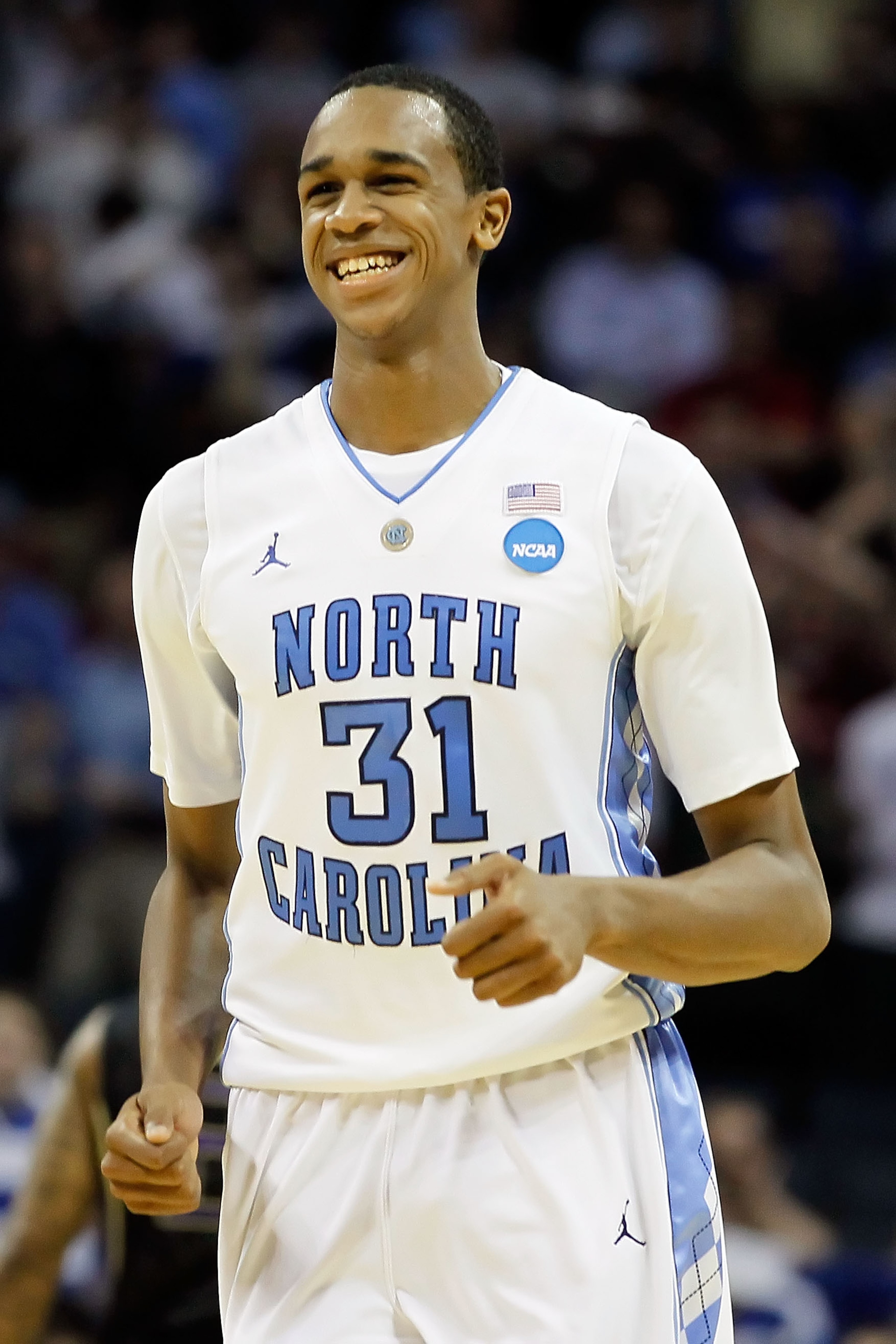 CHARLOTTE, NC - MARCH 20:  John Henson #31 of the North Carolina Tar Heels reacts after blocking the inbounds pass late in the second half before the Tar Heels defeated the Washington Huskies 86-83 during the third round of the 2011 NCAA men's basketball