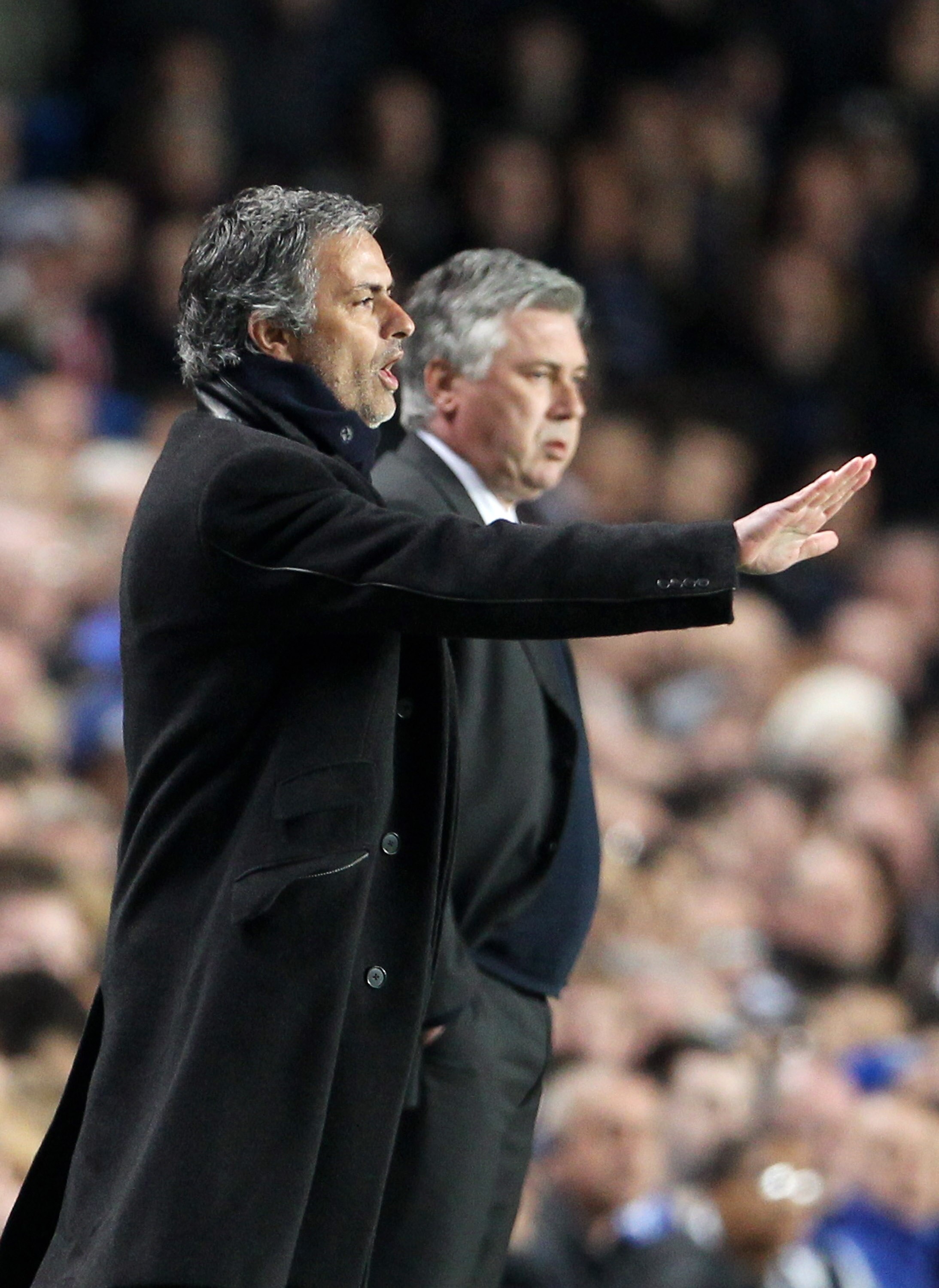 LONDON, ENGLAND - MARCH 16:  Jose Mourinho, Coach of Inter Milan gives instructions as Carlo Ancelotti, Manager of Chelsea looks on during the UEFA Champions League Round of 16 second leg match between Chelsea and Inter Milan at Stamford Bridge on March 1