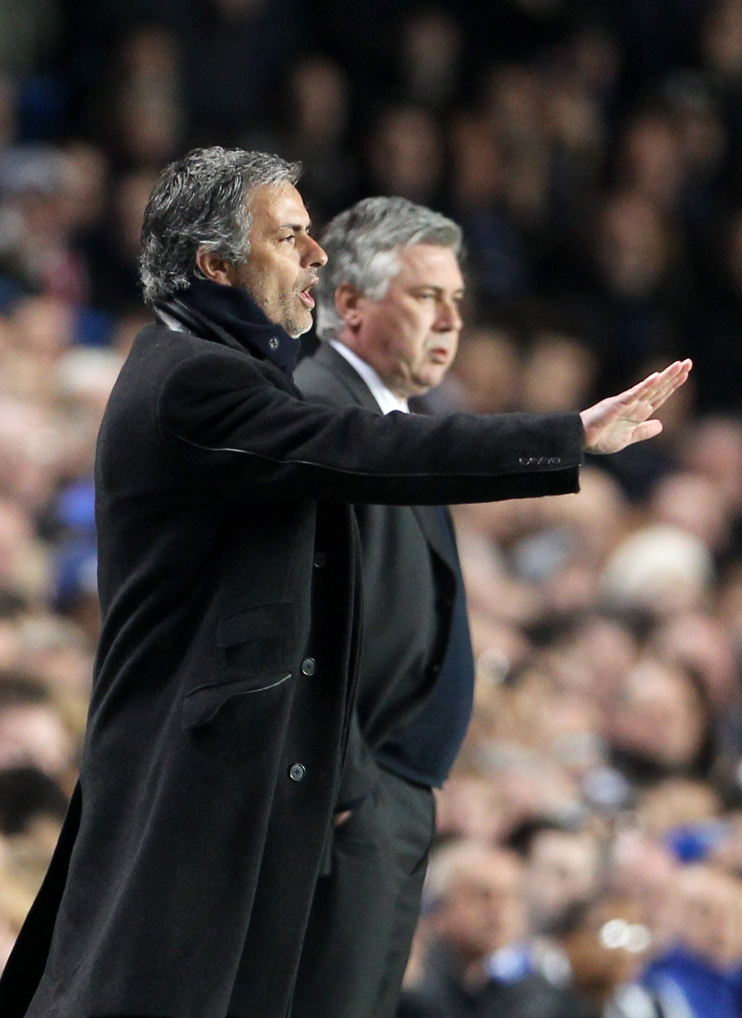 LONDON, ENGLAND - MARCH 16:  Jose Mourinho, Coach of Inter Milan gives instructions as Carlo Ancelotti, Manager of Chelsea looks on during the UEFA Champions League Round of 16 second leg match between Chelsea and Inter Milan at Stamford Bridge on March 1