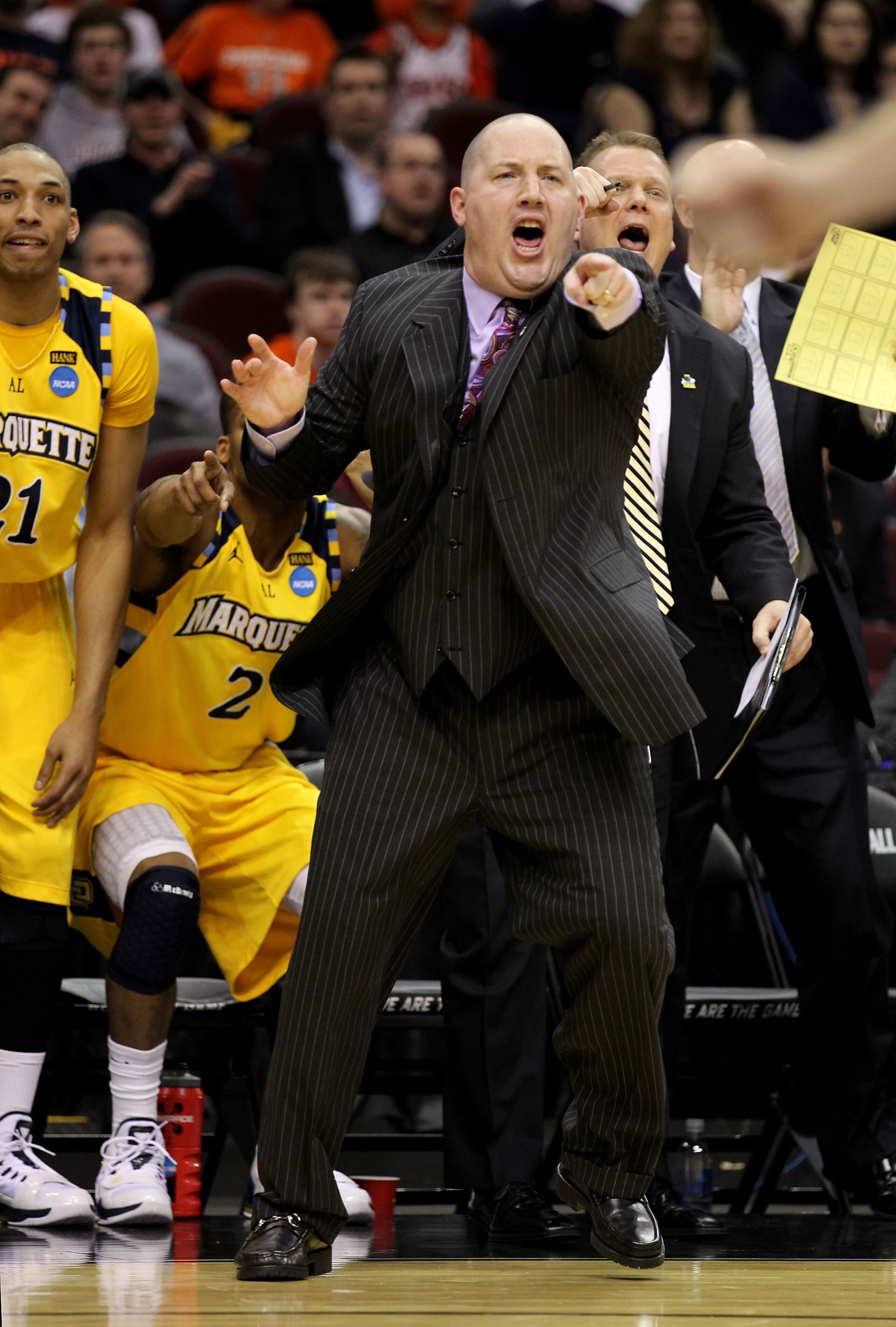 CLEVELAND, OH - MARCH 18: Head coach Buzz Williams and the Marquette Golden Eagles bench react during the first half against the Xavier Musketeers during the second round of the 2011 NCAA men's basketball tournament at Quicken Loans Arena on March 18, 201