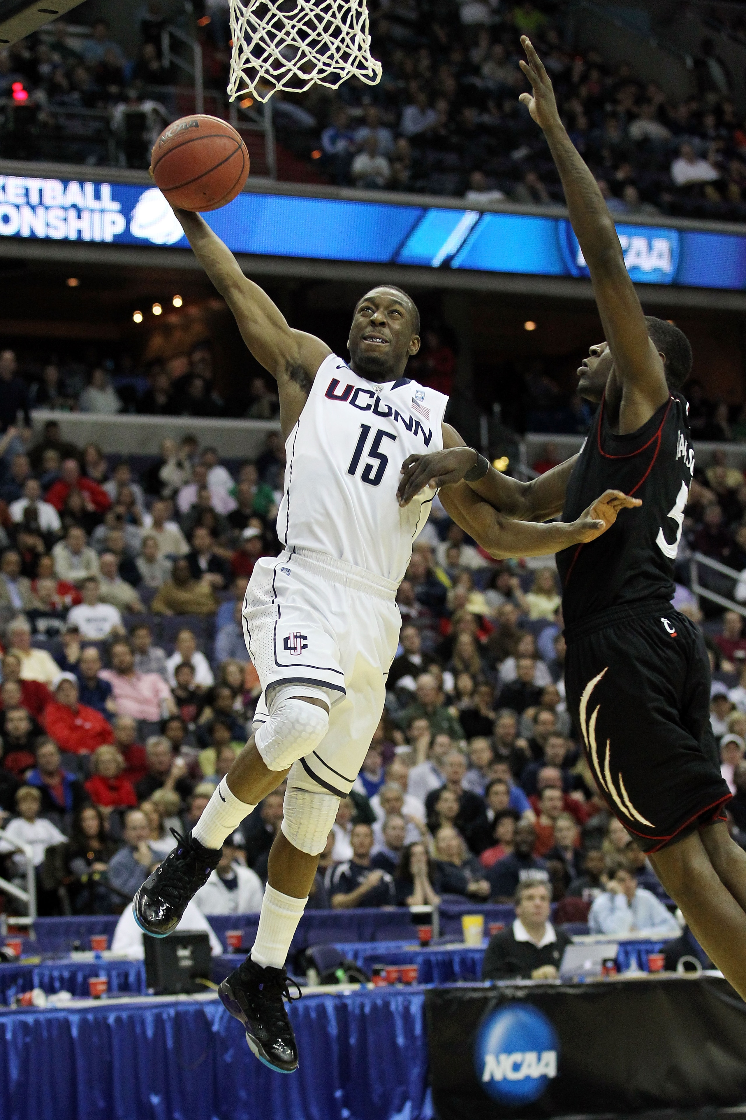 WASHINGTON - MARCH 19: Kemba Walker #15 of the Connecticut Huskies goes in for a layup against the Cincinnati Bearcats during the third round of the 2011 NCAA men's basketball tournament at Verizon Center on March 19, 2011 in Washington, DC. (Photo by N WASHINGTON - MARCH 19: Kemba Walker #15 of the Connecticut Huskies goes in for a layup against the Cincinnati Bearcats during the third round of the 2011 NCAA men's basketball tournament at Verizon Center on March 19, 2011 in Washington, DC. (Photo by N