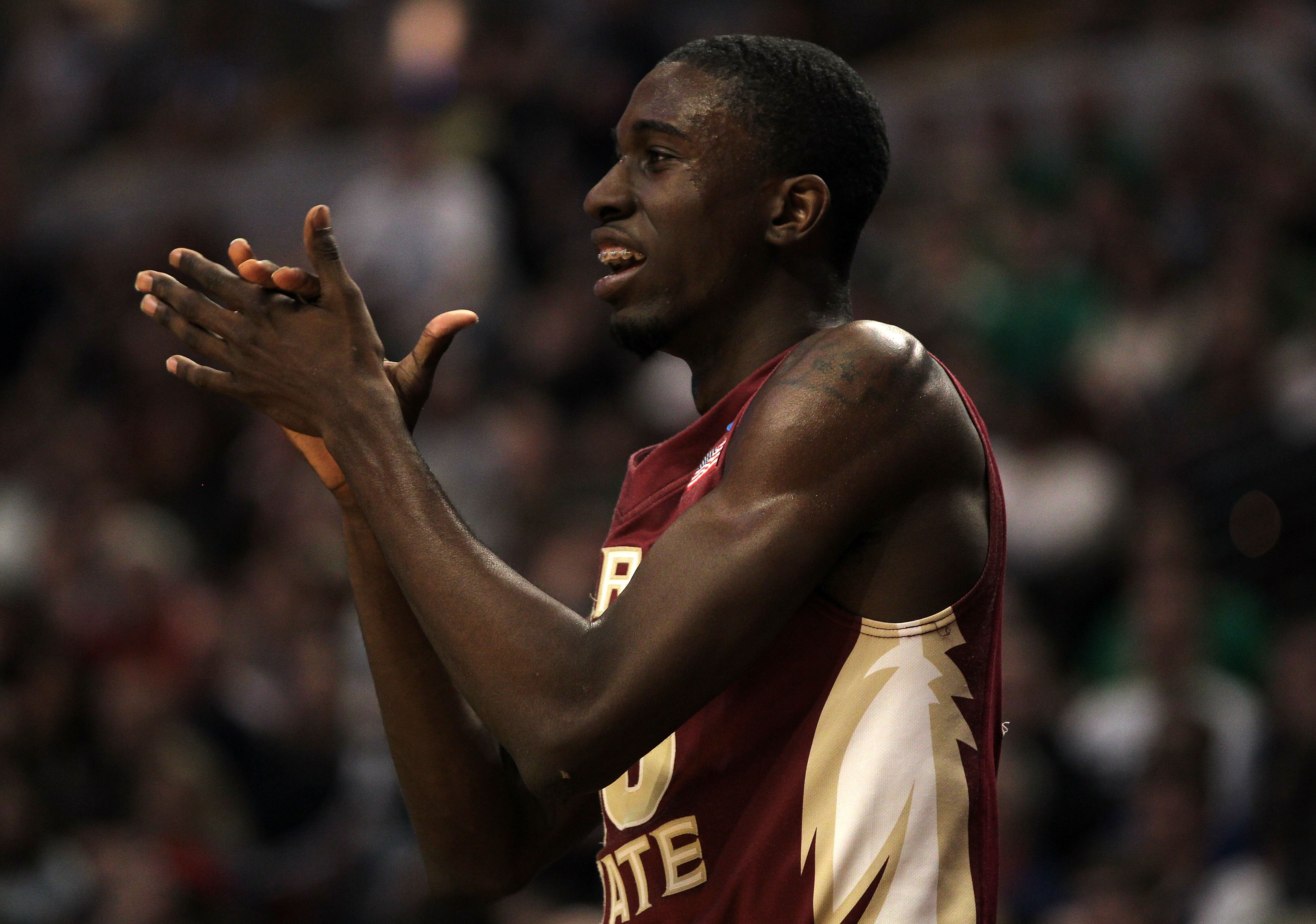 CHICAGO, IL - MARCH 20:  Okaro White #10 of the Florida State Seminoles cheers for the team in the first half against the Notre Dame Fighting Irish during the third round of the 2011 NCAA men's basketball tournament at the United Center on March 20, 2011