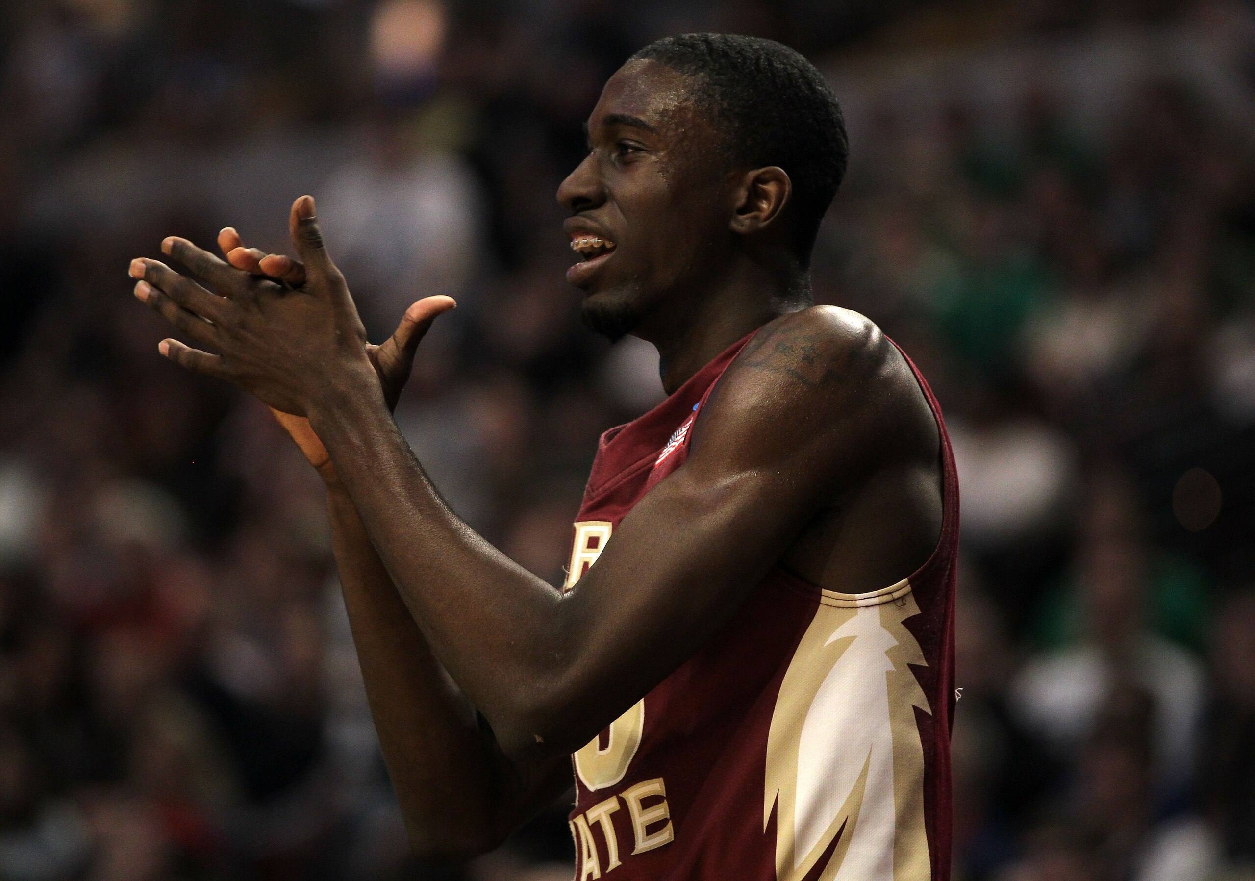 CHICAGO, IL - MARCH 20:  Okaro White #10 of the Florida State Seminoles cheers for the team in the first half against the Notre Dame Fighting Irish during the third round of the 2011 NCAA men's basketball tournament at the United Center on March 20, 2011