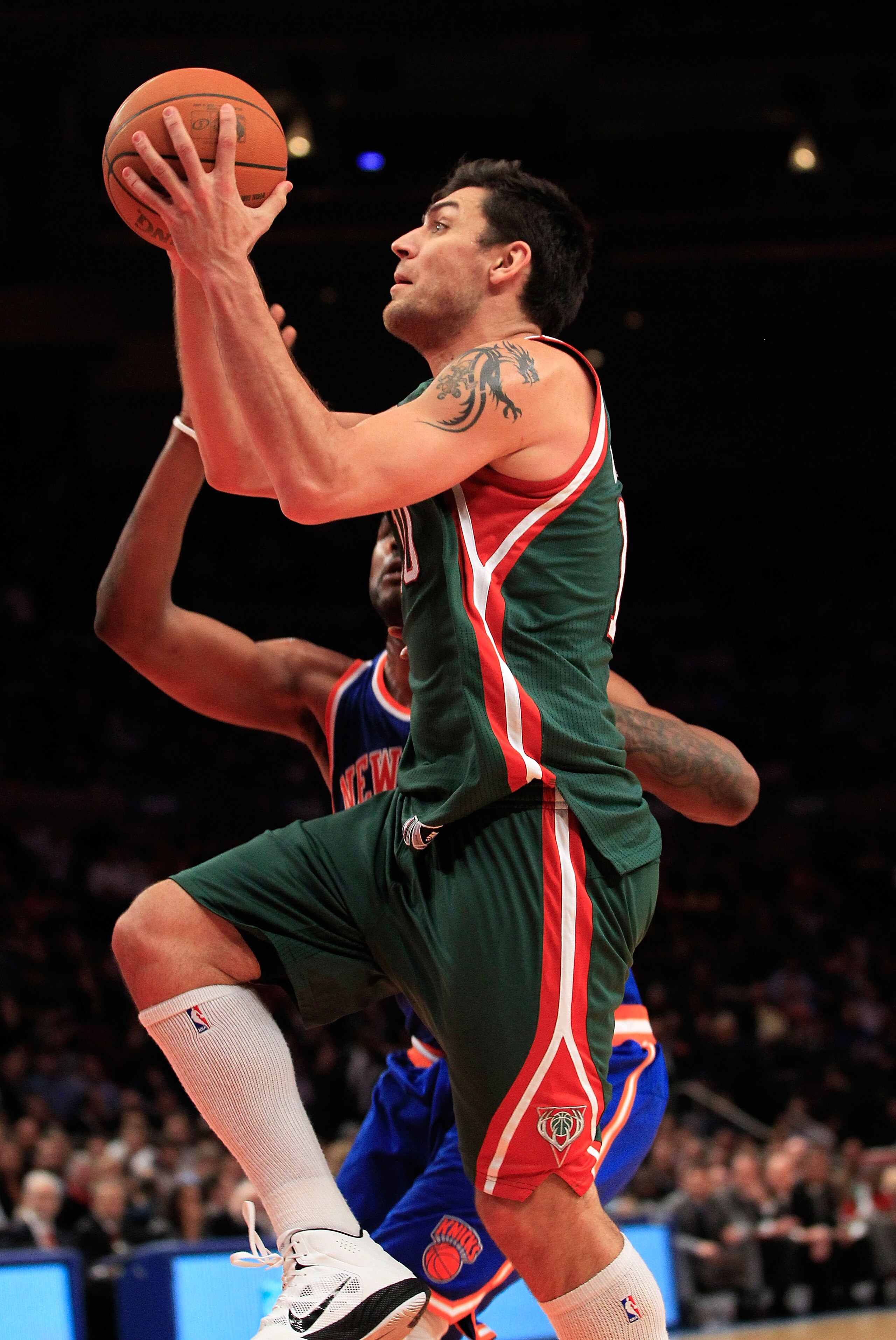 NEW YORK, NY - FEBRUARY 23: Carlos Delfino #10 of the Milwaukee Bucks shoots the ball against the New York Knicks at Madison Square Garden on February 23, 2011 in New York City. NOTE TO USER: User expressly acknowledges and agrees that, by downloading and