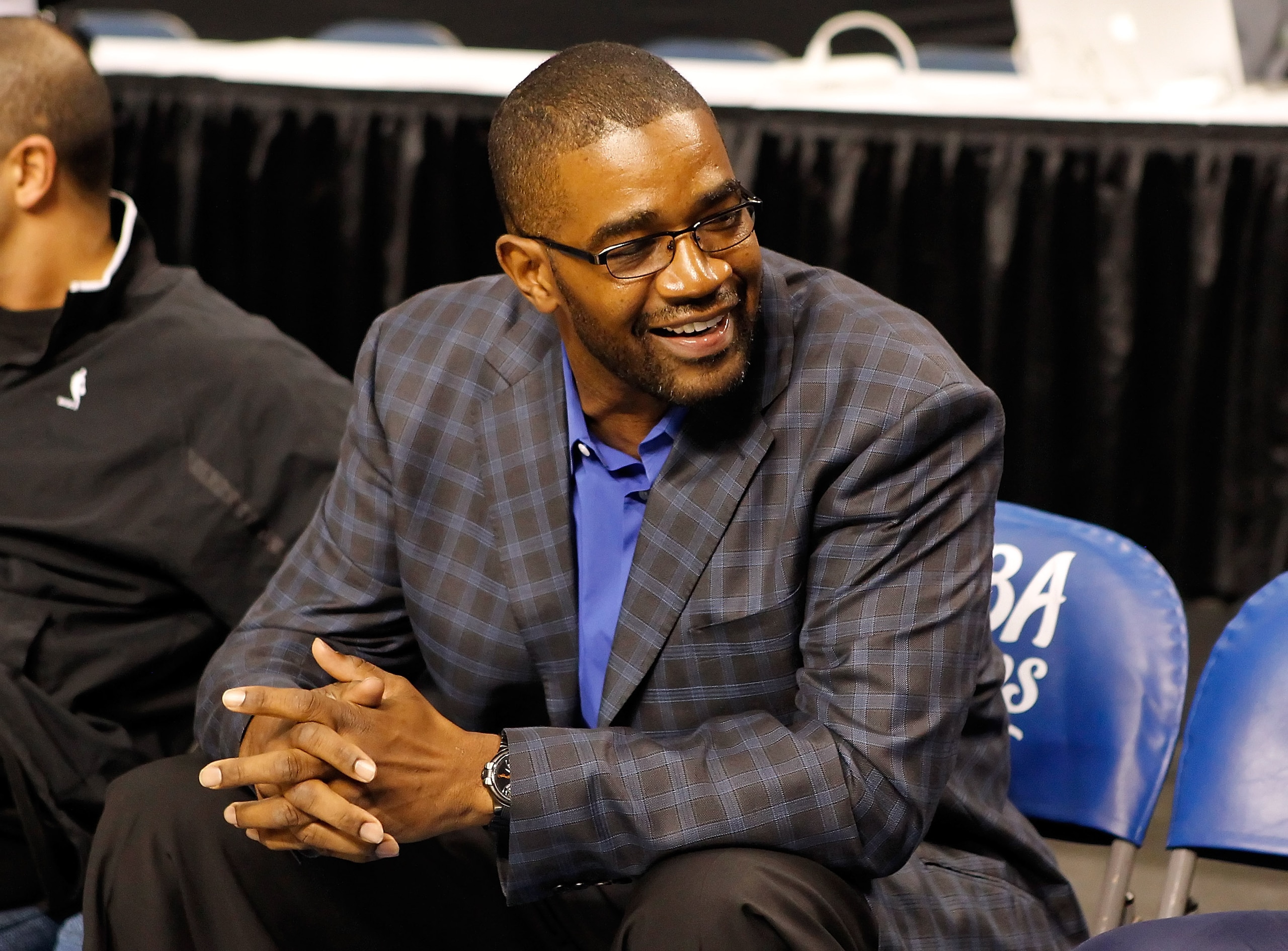 TAMPA, FL - OCTOBER 22:  General Manager Otis Smith of the Orlando Magic smiles on the bench before the game against the Miami Heat was cancelled at the St. Pete Times Forum on October 22, 2010 in Tampa, Florida.  NOTE TO USER: User expressly acknowledges