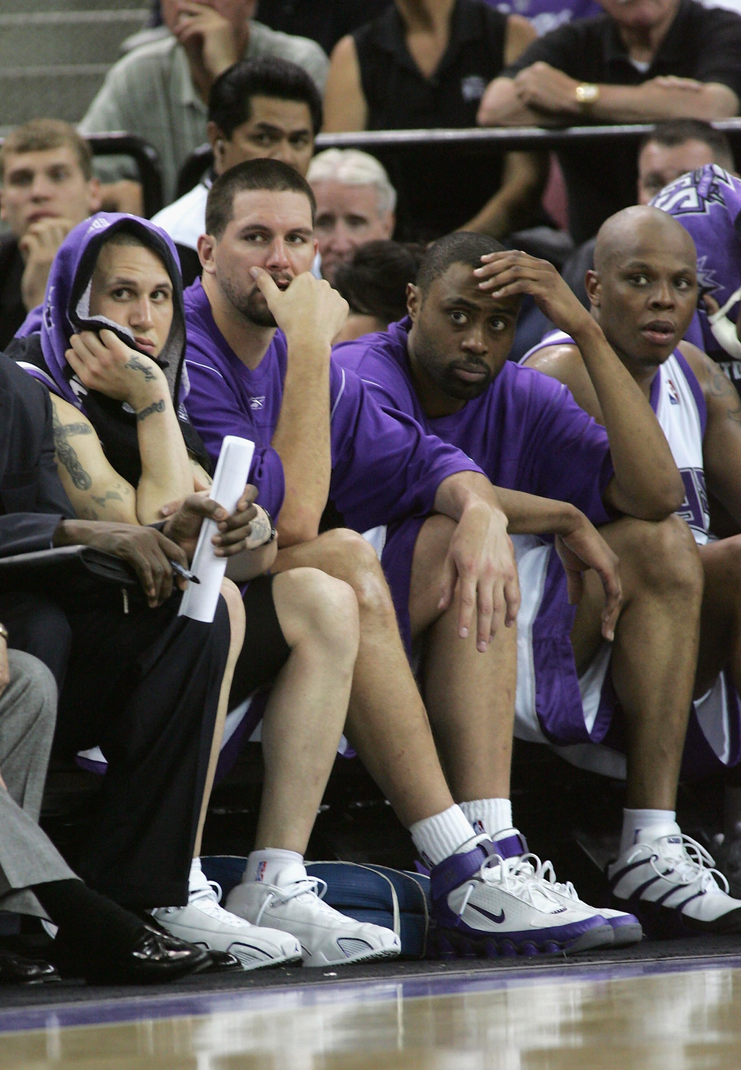 SACRAMENTO, CA - MAY 5: (L-R) Mike Bibby #10, Brad Miller #52, Kenny Thomas #9, Bonzi Wells #42 of the Sacramento Kings sit dejected on the bench as they lose game six of the Western Conference Quarterfinals against the San Antonio Spurs during the 2006 SACRAMENTO, CA - MAY 5: (L-R) Mike Bibby #10, Brad Miller #52, Kenny Thomas #9, Bonzi Wells #42 of the Sacramento Kings sit dejected on the bench as they lose game six of the Western Conference Quarterfinals against the San Antonio Spurs during the 2006
