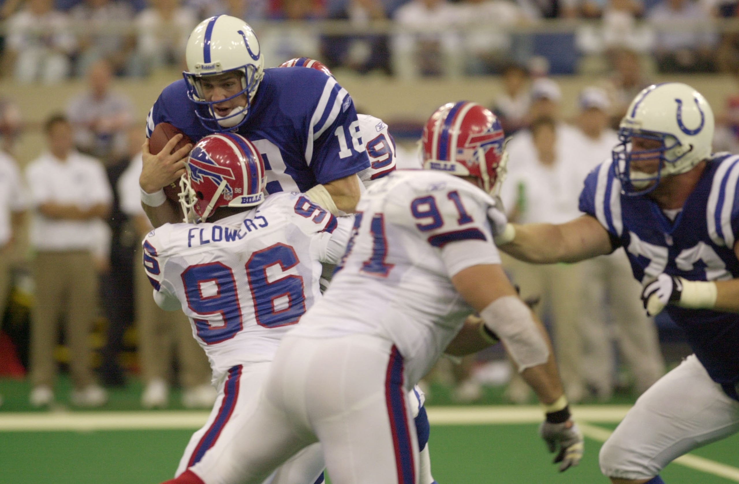 23 Sep 2001: Quarterback Peyton Manning #18 of theIndianapolis Colts is hit by Erik Flowers #96 of the Buffalo Bills during the game at the RCA Dome in Indianapolis, Indiana.  The Rams won 30-26. DIGITAL IMAGE Mandatory Credit: Ron Hoskins/ALLSPORT