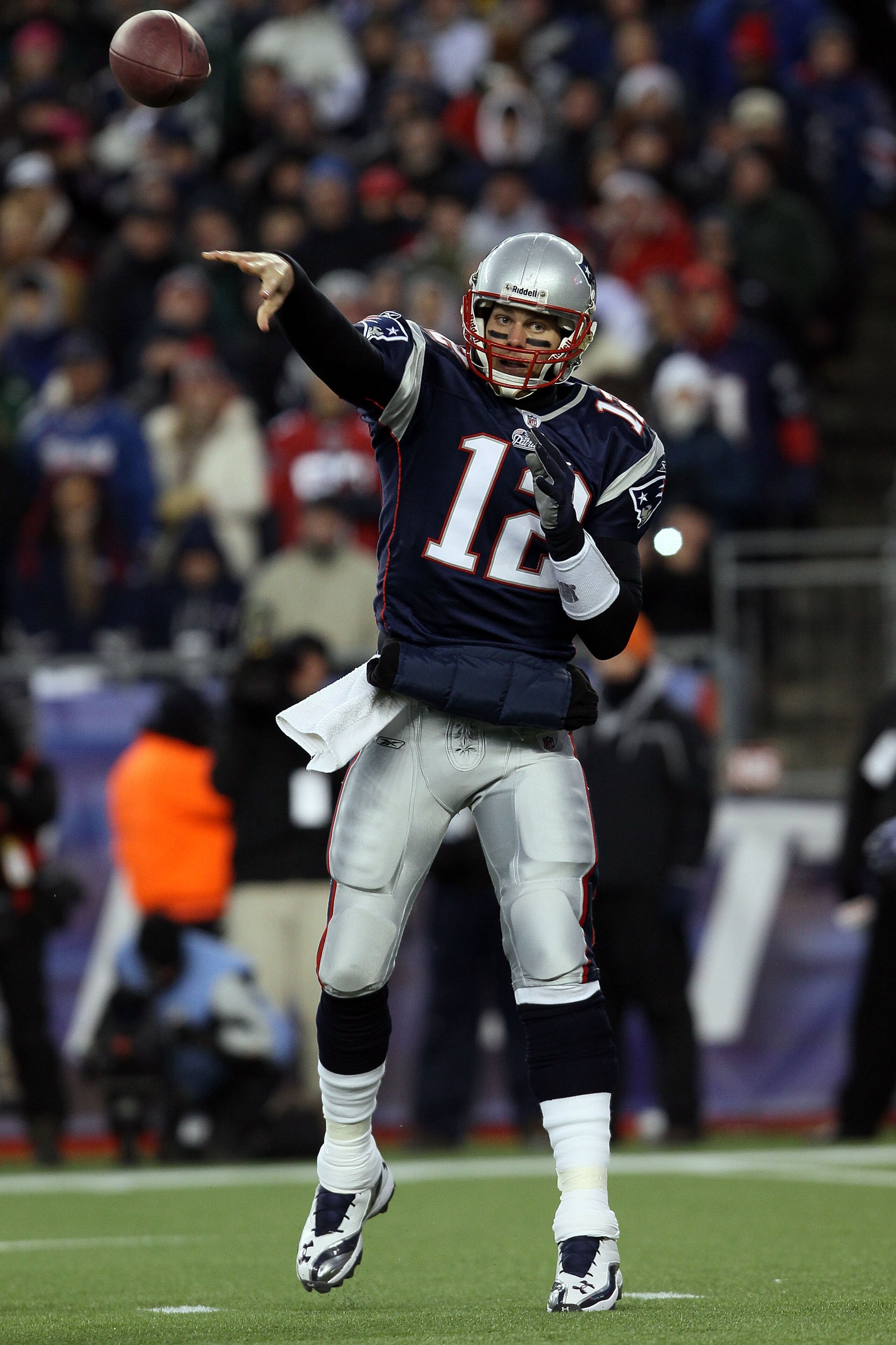 FOXBORO, MA - JANUARY 16:  Tom Brady #12 of the New England Patriots passes against the New York Jets during their 2011 AFC divisional playoff game at Gillette Stadium on January 16, 2011 in Foxboro, Massachusetts.  (Photo by Elsa/Getty Images)