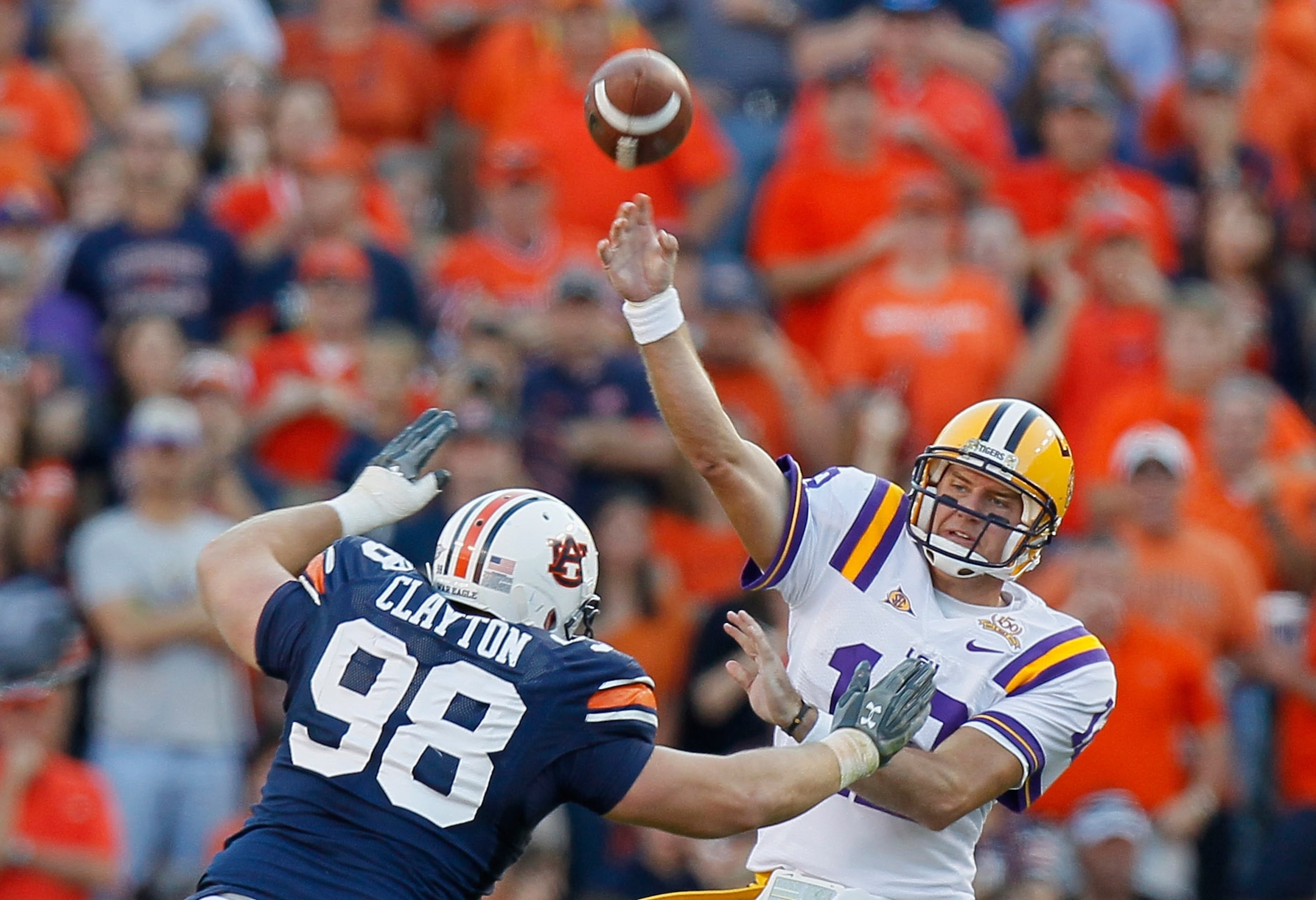 AUBURN, AL - OCTOBER 23:  Zach Clayton #98 of the Auburn Tigers pressures quarterback Jarrett Lee #12 of the LSU Tigers at Jordan-Hare Stadium on October 23, 2010 in Auburn, Alabama.  (Photo by Kevin C. Cox/Getty Images)