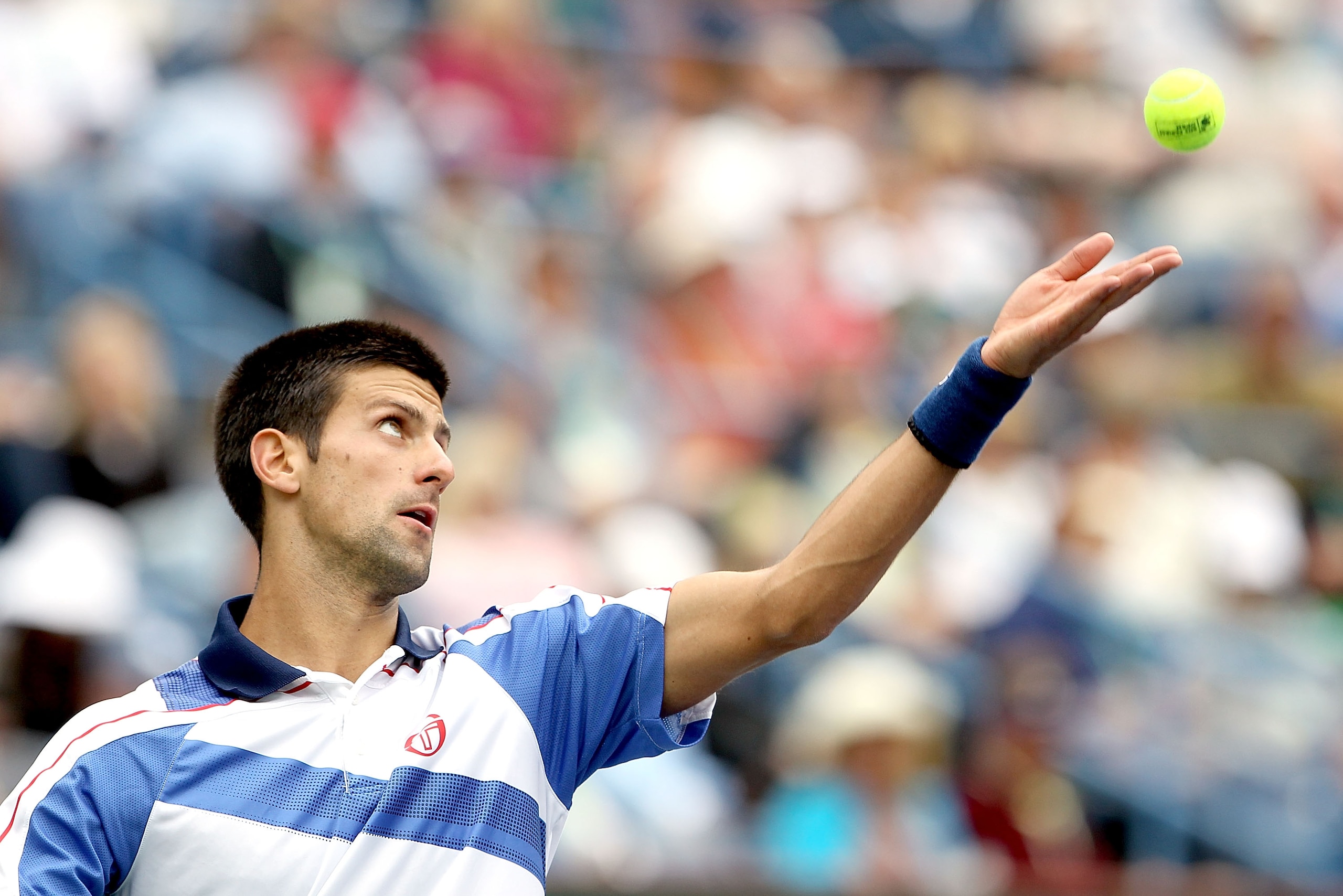 INDIAN WELLS, CA - MARCH 20:  Novak Djokovic of Serbia serves to Rafael Nadal of Spain during the final of the BNP Paribas Open at the Indian Wells Tennis Garden on March 20, 2011 in Indian Wells, California.  (Photo by Matthew Stockman/Getty Images)