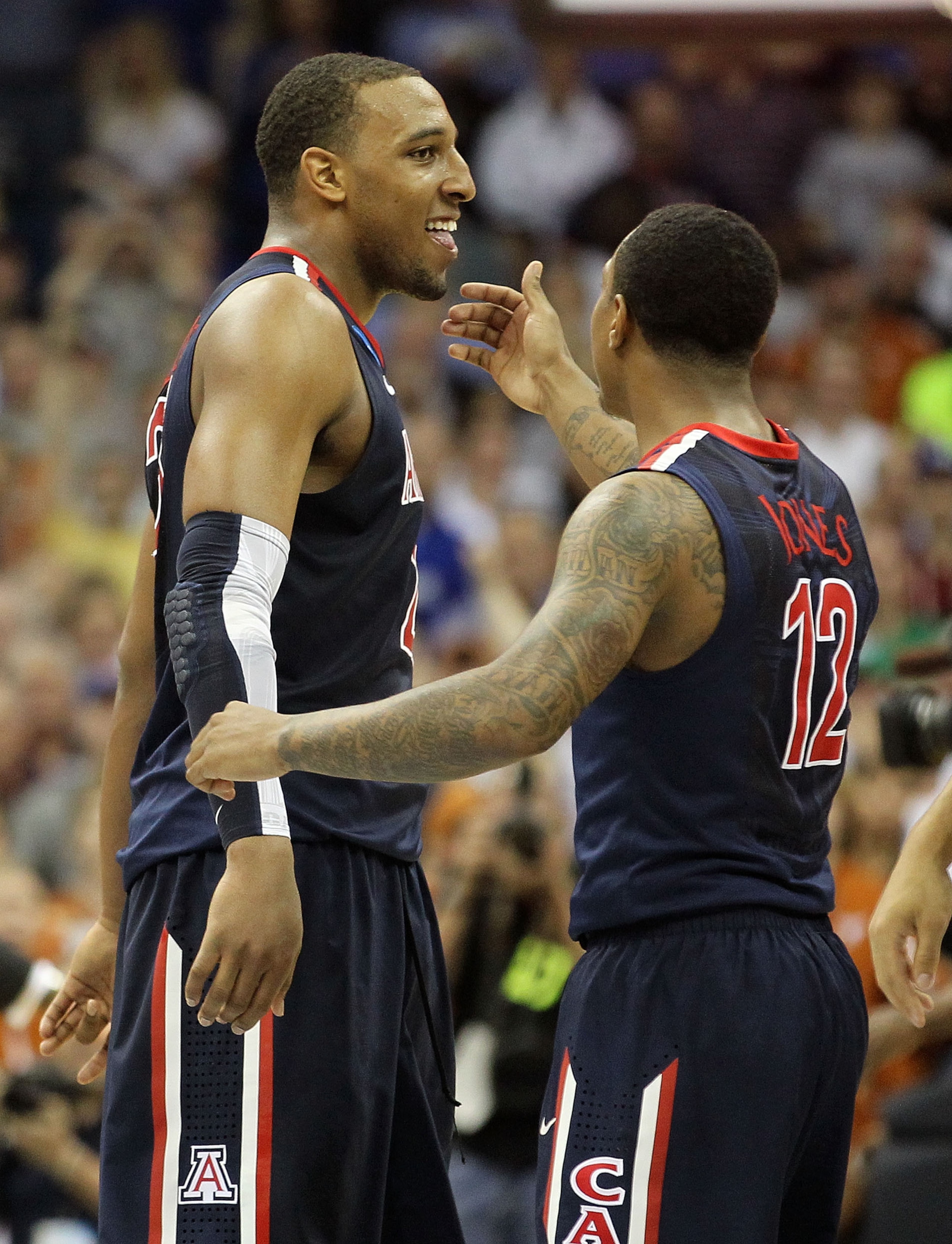 TULSA, OK - MARCH 20:  Derrick Williams #23 of the Arizona Wildcats celebrates with teammate Lamont Jones #12 after defeating the Texas Longhorns 70-69 in the third round of the 2011 NCAA men's basketball tournament at BOK Center on March 20, 2011 in Tuls