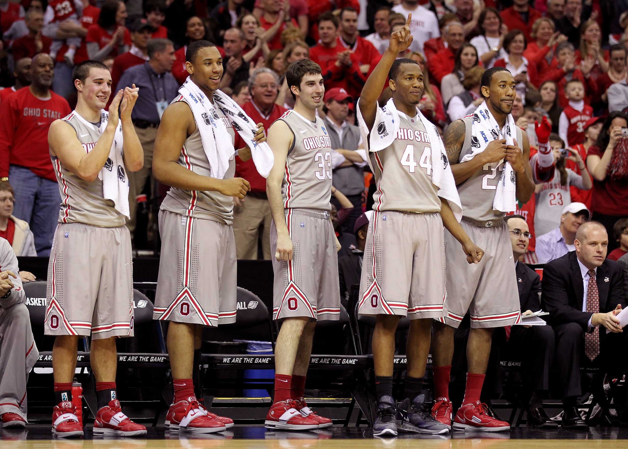 CLEVELAND, OH - MARCH 20:  Aaron Craft #4, Jared Sullinger #0, Jon Diebler #33, William Buford #44 and David Lighty #23 of the Ohio State Buckeyes look on from the bench late in the second half against the George Mason Patriots during the third of the 201