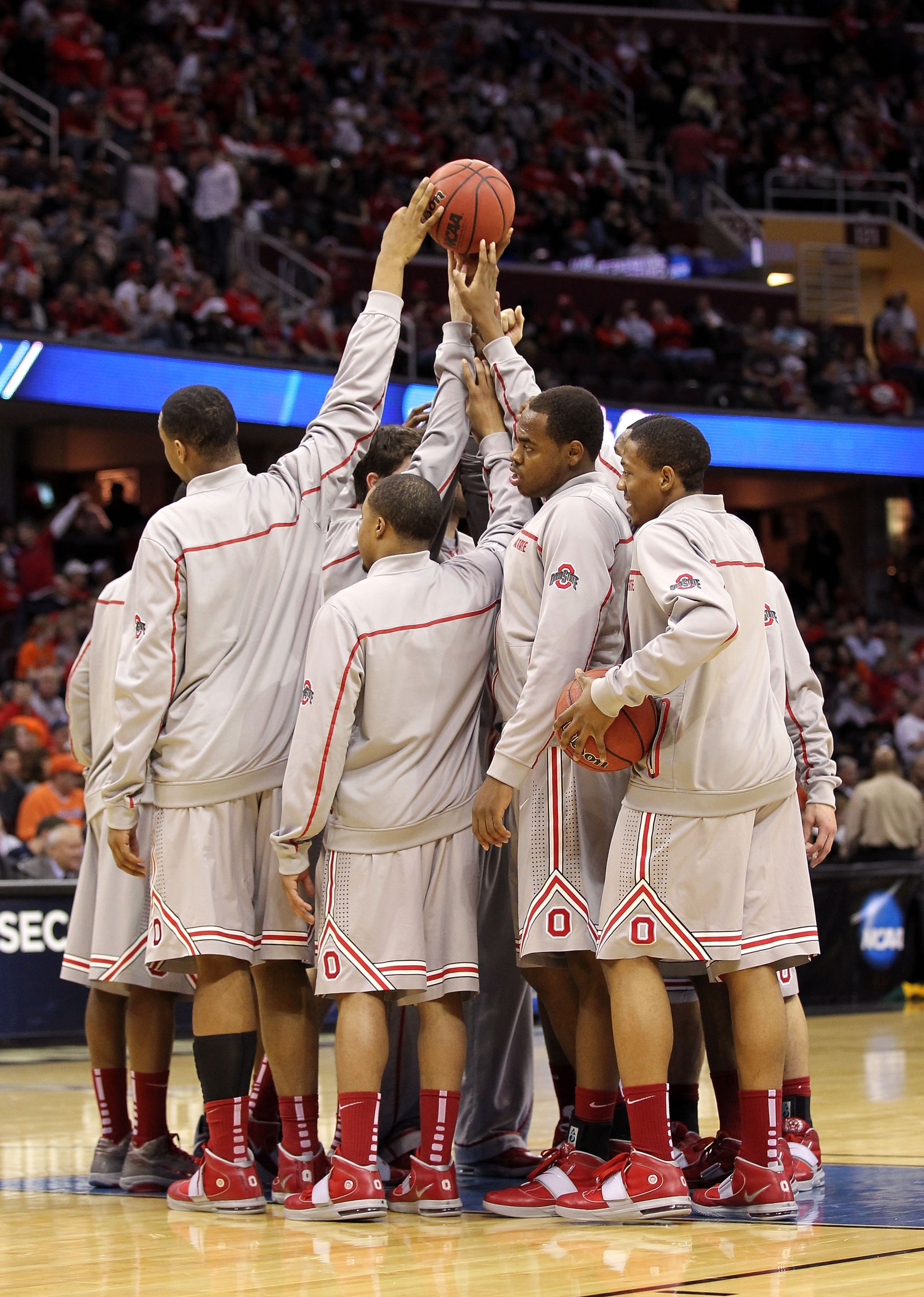 CLEVELAND, OH - MARCH 20: The Ohio State Buckeyes huddle before the start of the second half against the George Mason Patriots during the third of the 2011 NCAA men's basketball tournament at Quicken Loans Arena on March 20, 2011 in Cleveland, Ohio.  (Pho