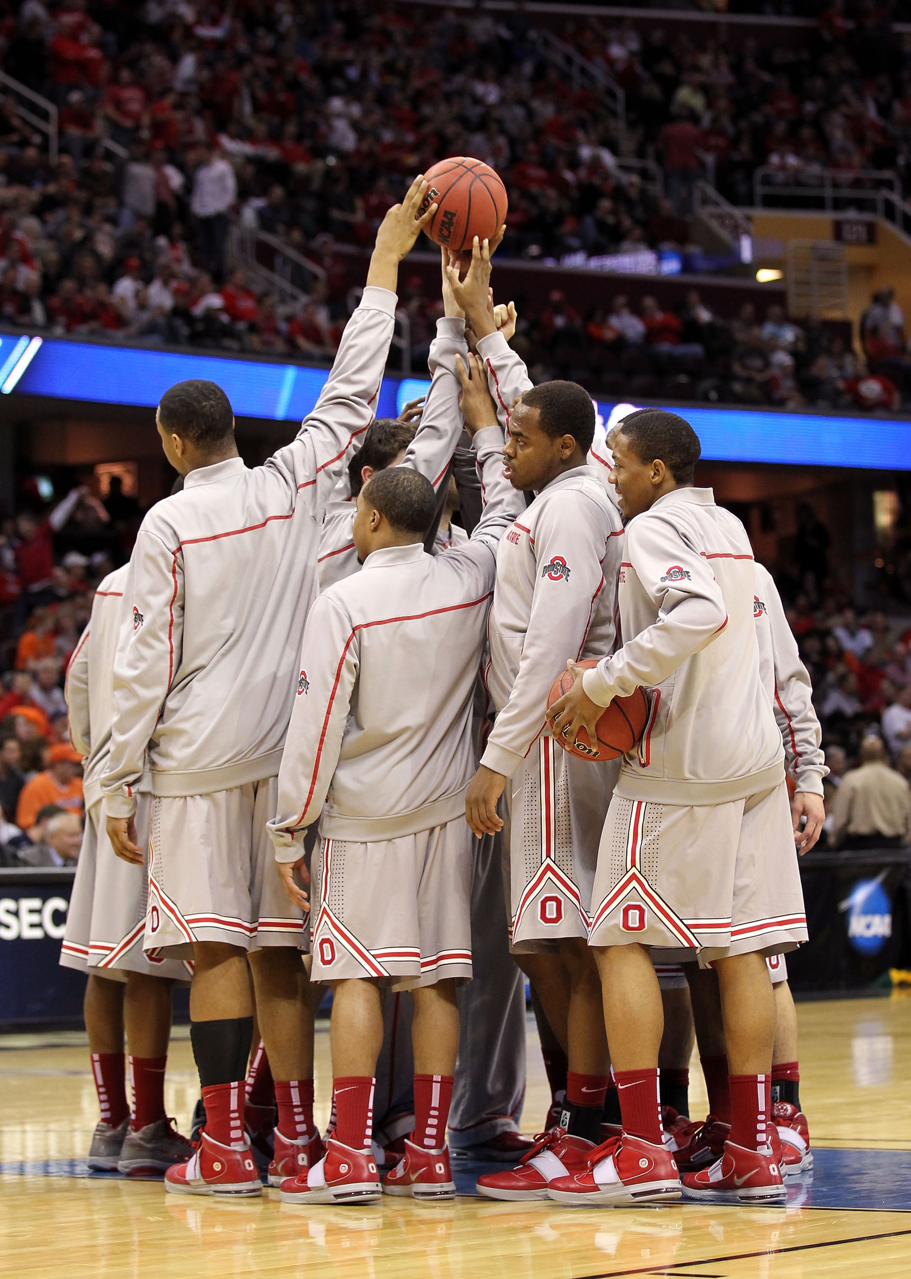 CLEVELAND, OH - MARCH 20: The Ohio State Buckeyes huddle before the start of the second half against the George Mason Patriots during the third of the 2011 NCAA men's basketball tournament at Quicken Loans Arena on March 20, 2011 in Cleveland, Ohio.  (Pho