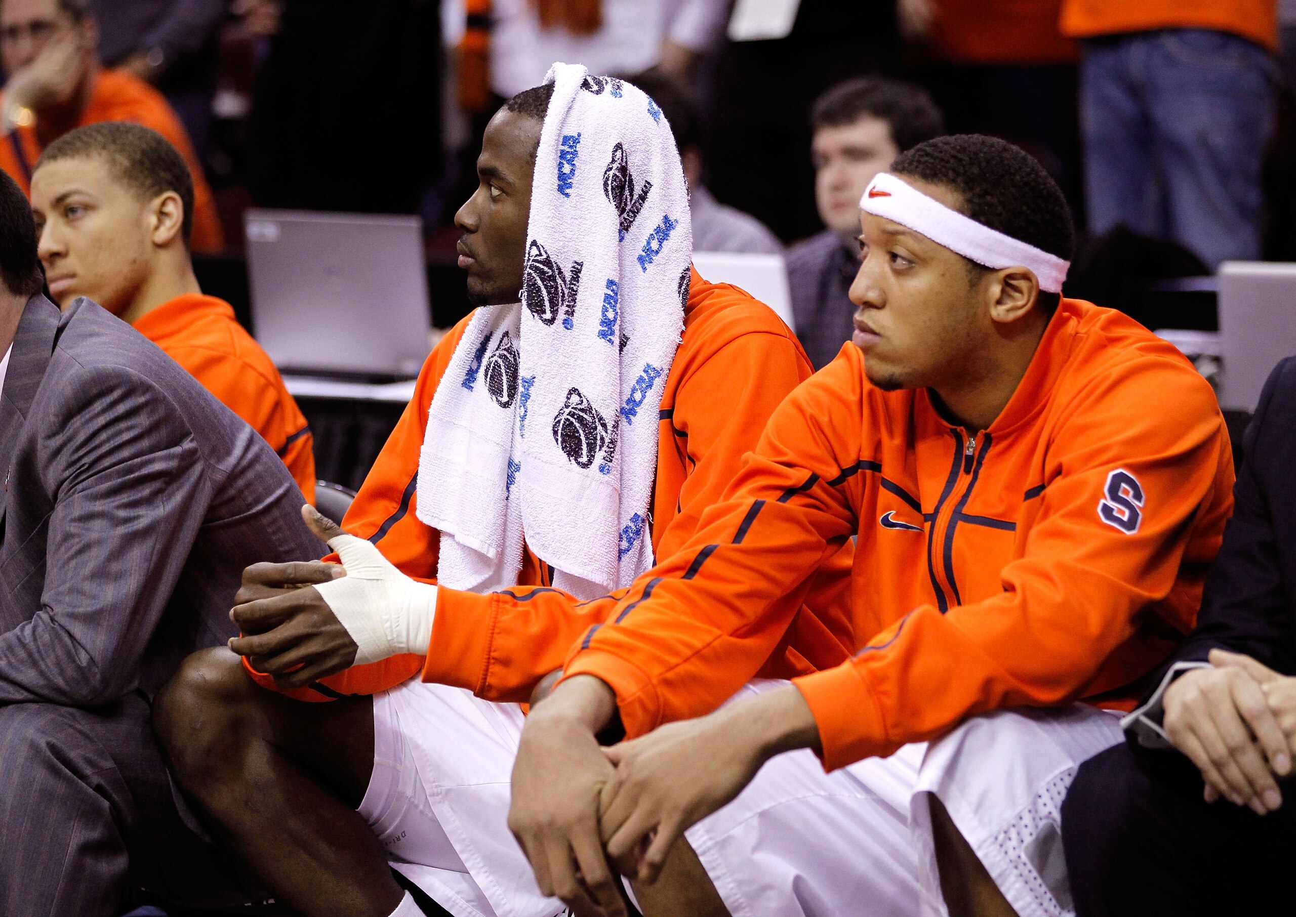 CLEVELAND, OH - MARCH 20: Baye Moussa Keita #12 and Mookie Jones #21 of the Syracuse Orange look on from the bench after being defeated by the Marquette Golden Eagles during the third of the 2011 NCAA men's basketball tournament at Quicken Loans Arena on