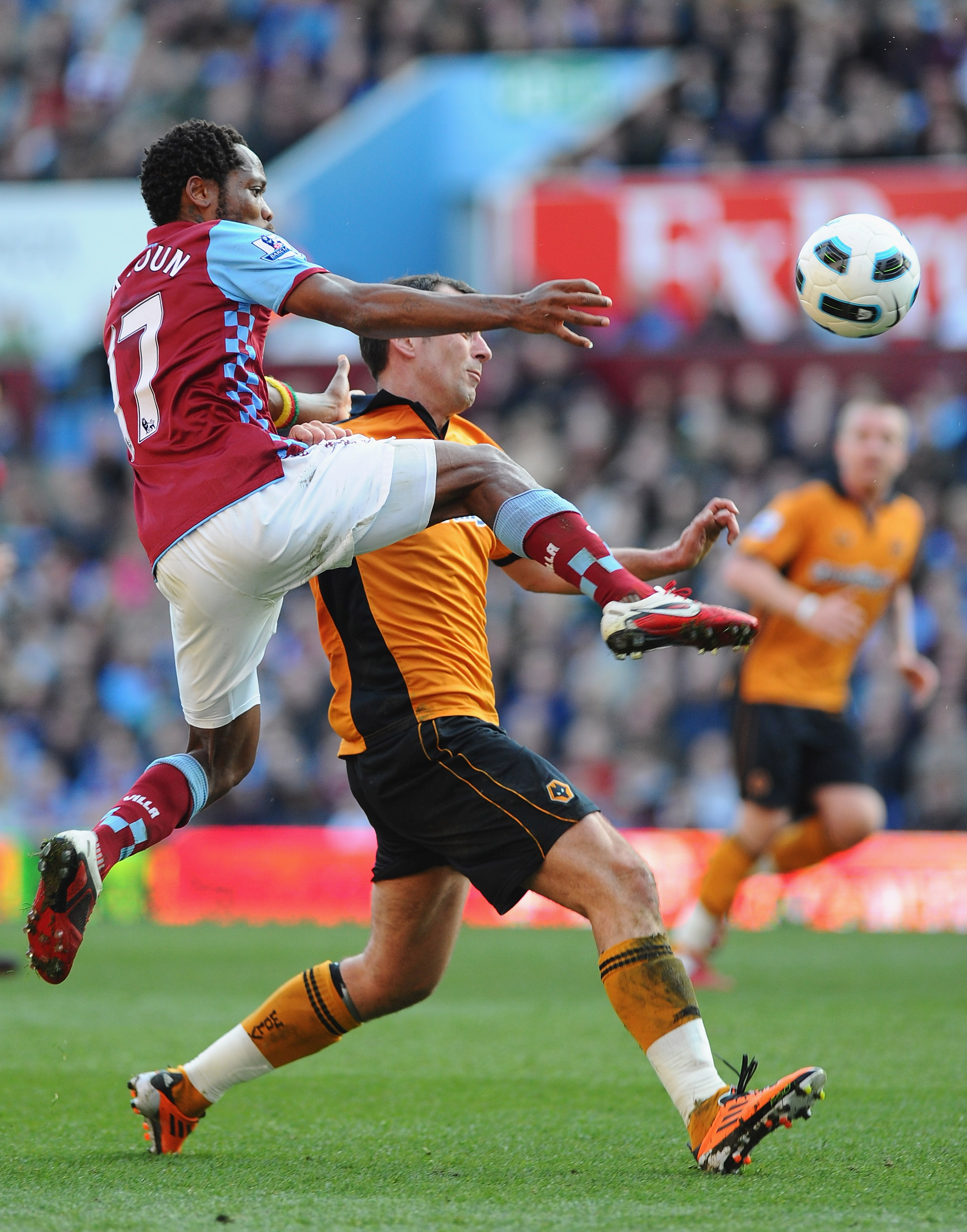 BIRMINGHAM, ENGLAND - MARCH 19:  Jean Makoun (L) of Aston Villa challenges Nenad Milijas of Wolves during the Barclays Premier League match between Aston Villa and Wolverhampton Wanderers at Villa Park on March 19, 2011 in Birmingham, England.  (Photo by