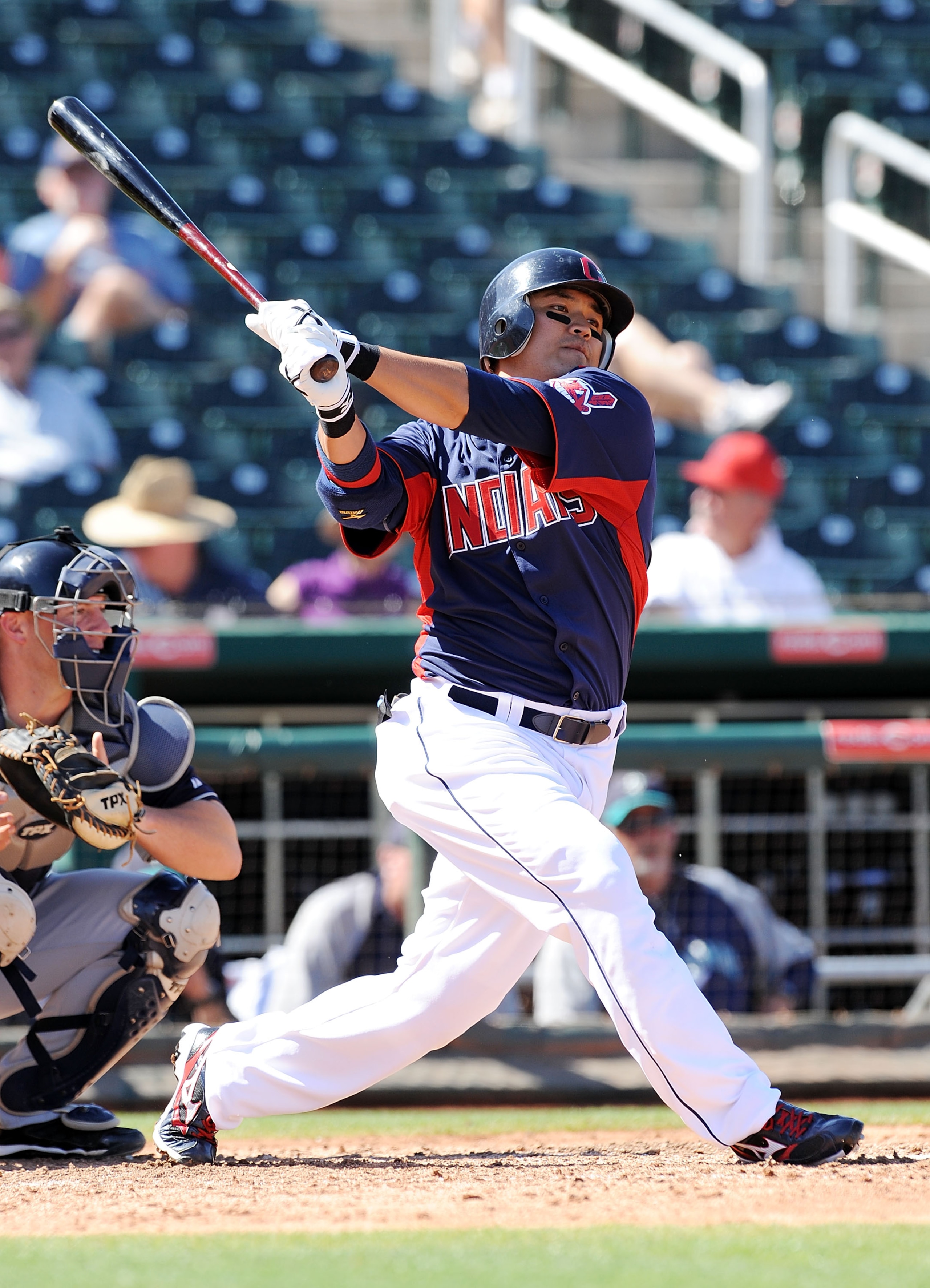 GOODYEAR, AZ - MARCH 11:  Shin-Soo Choo #17 of the Cleveland Indians follows through on a swing against the Seattle Mariners at Goodyear Ballpark on March 11, 2011 in Goodyear, Arizona.  (Photo by Norm Hall/Getty Images)