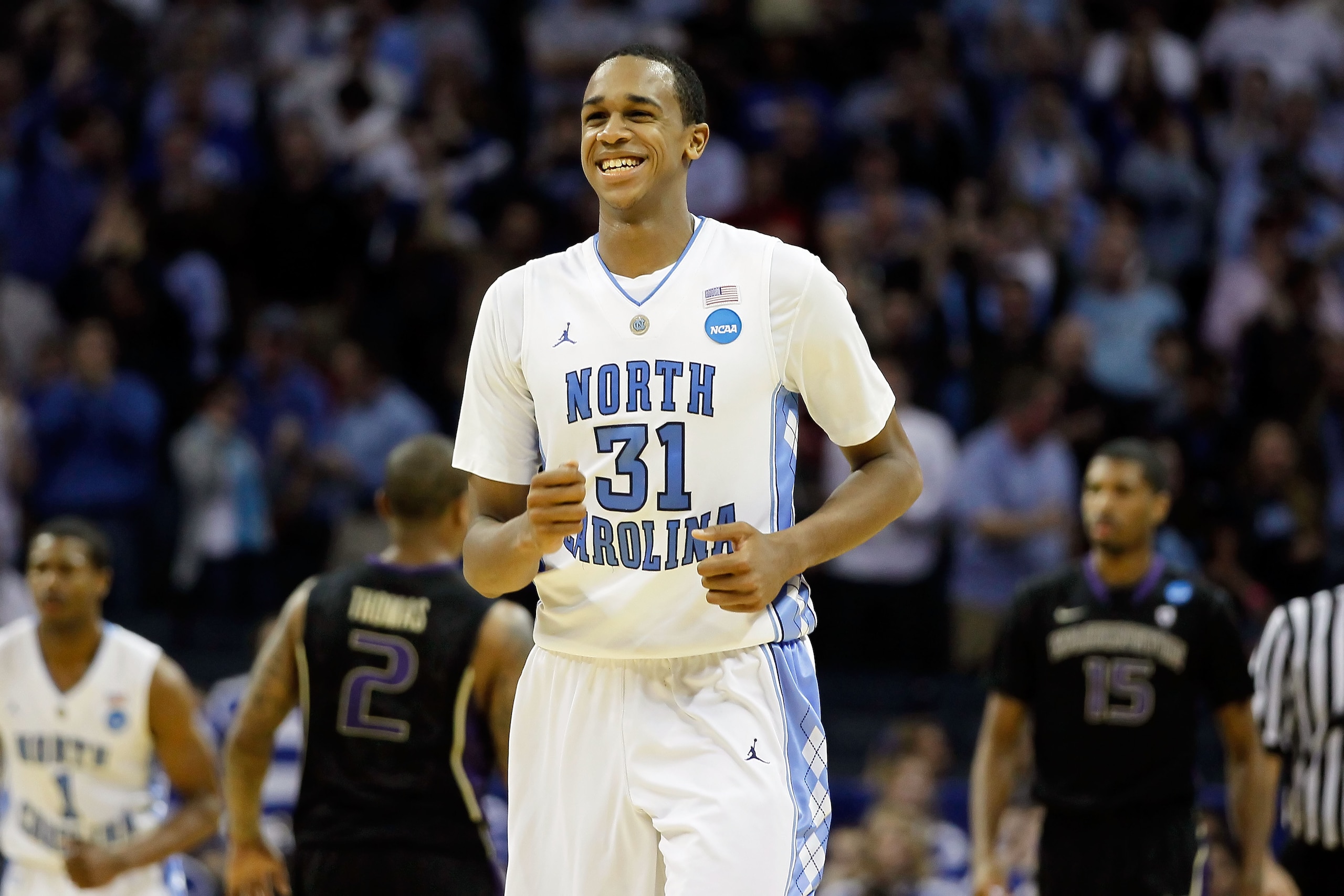 CHARLOTTE, NC - MARCH 20: John Henson #31 of the North Carolina Tar Heels reacts after blocking the inbounds pass late in the second half before the Tar Heels defeated the Washington Huskies 86-83 during the third round of the 2011 NCAA men's basketball CHARLOTTE, NC - MARCH 20: John Henson #31 of the North Carolina Tar Heels reacts after blocking the inbounds pass late in the second half before the Tar Heels defeated the Washington Huskies 86-83 during the third round of the 2011 NCAA men's basketball