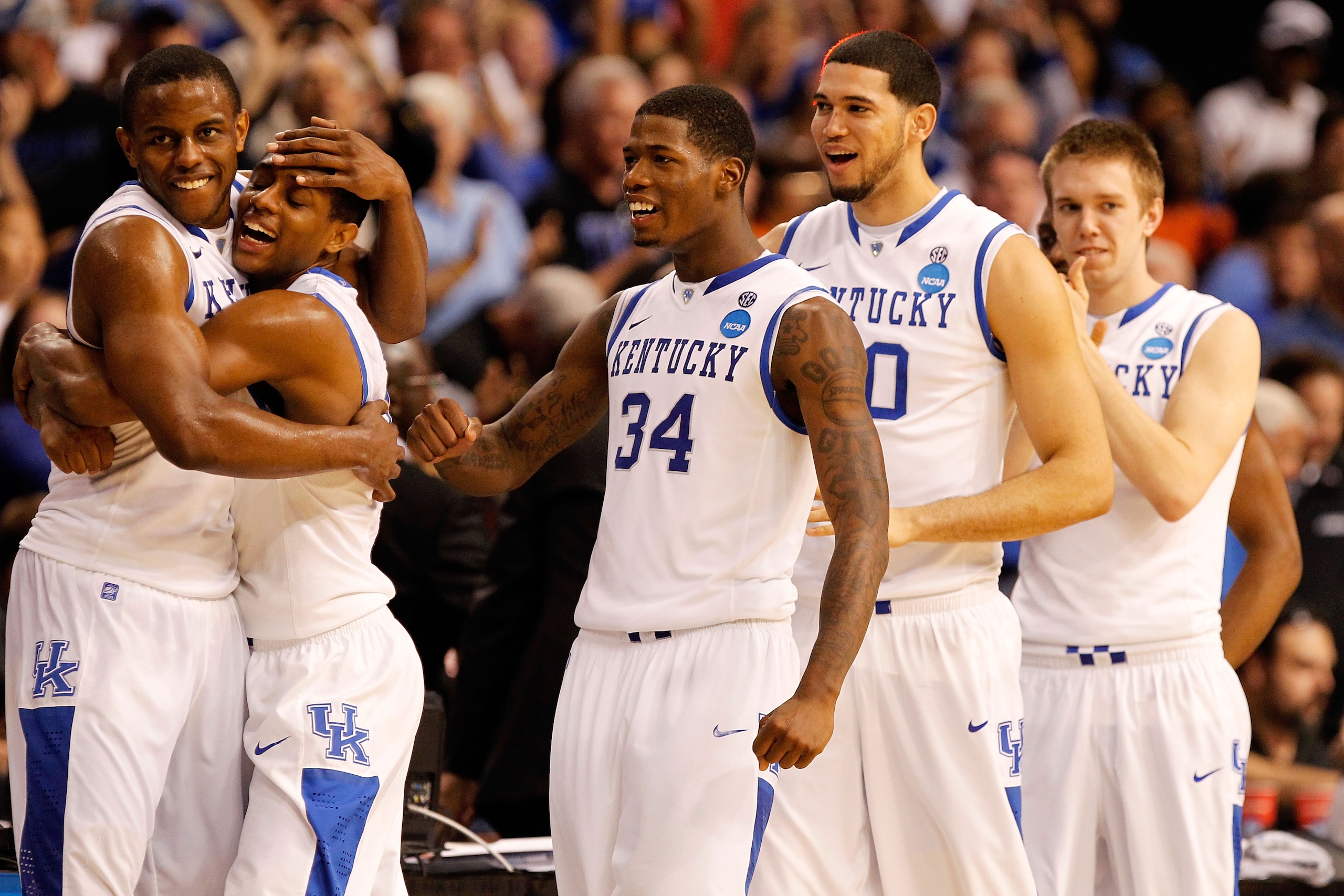 TAMPA, FL - MARCH 19: Darius Miller #1, Brandon Knight #12, DeAndre Liggins #34, Eloy Vargas #30 and Jon Hood #4 of the Kentucky Wildcats celebrate after they won 71-63 against the West Virginia Mountaineers during the third round of the 2011 NCAA men's TAMPA, FL - MARCH 19: Darius Miller #1, Brandon Knight #12, DeAndre Liggins #34, Eloy Vargas #30 and Jon Hood #4 of the Kentucky Wildcats celebrate after they won 71-63 against the West Virginia Mountaineers during the third round of the 2011 NCAA men's