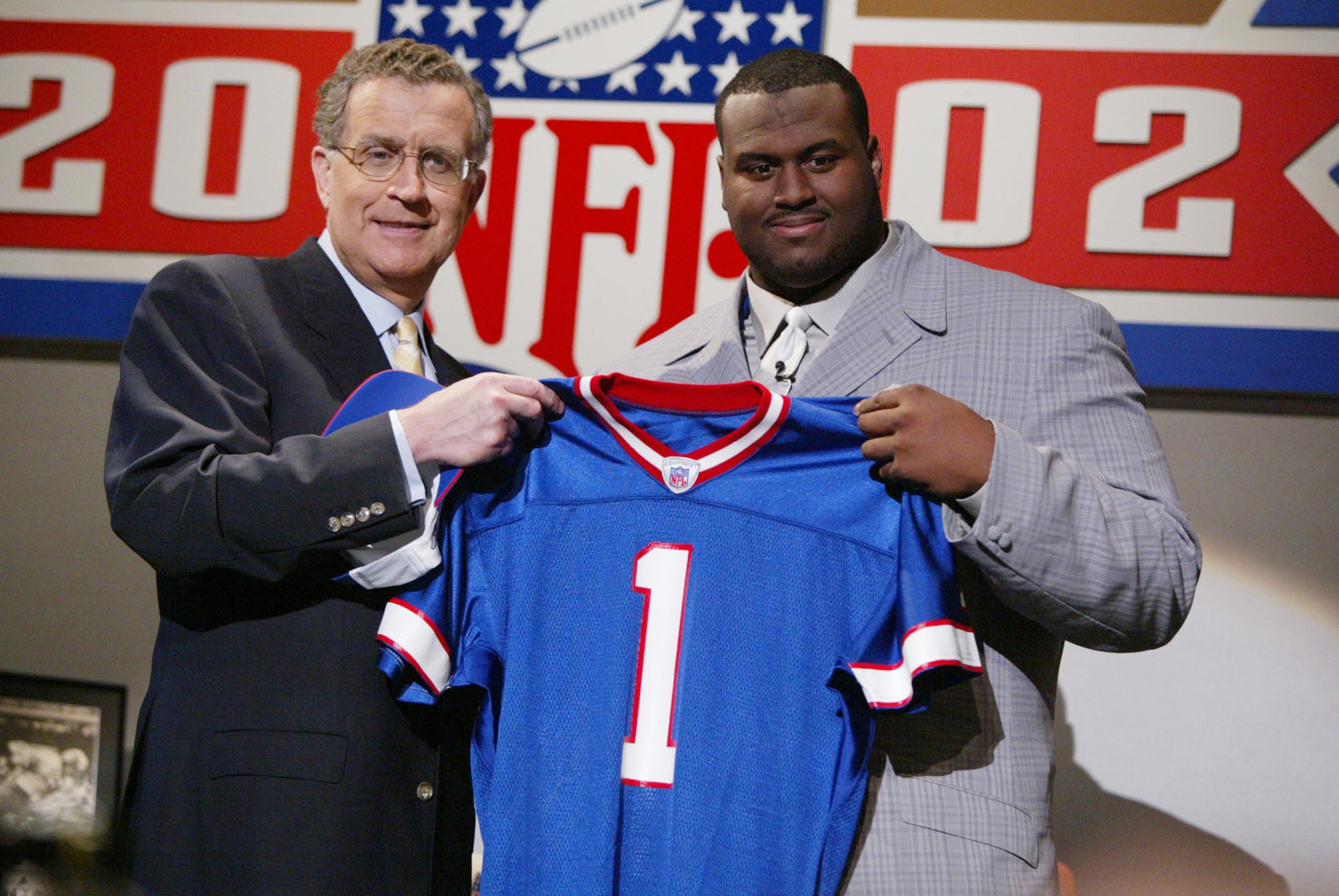 20 April 2002:  Mike Williams of Texas stands with NFL Commisioner Paul Tagliabue after being the fourth player selected in the 2002 NFL draft at the Theatre in Madison Square Garden in New York City, New York.   Digital Image.  Mandatory Credit: Al Bello