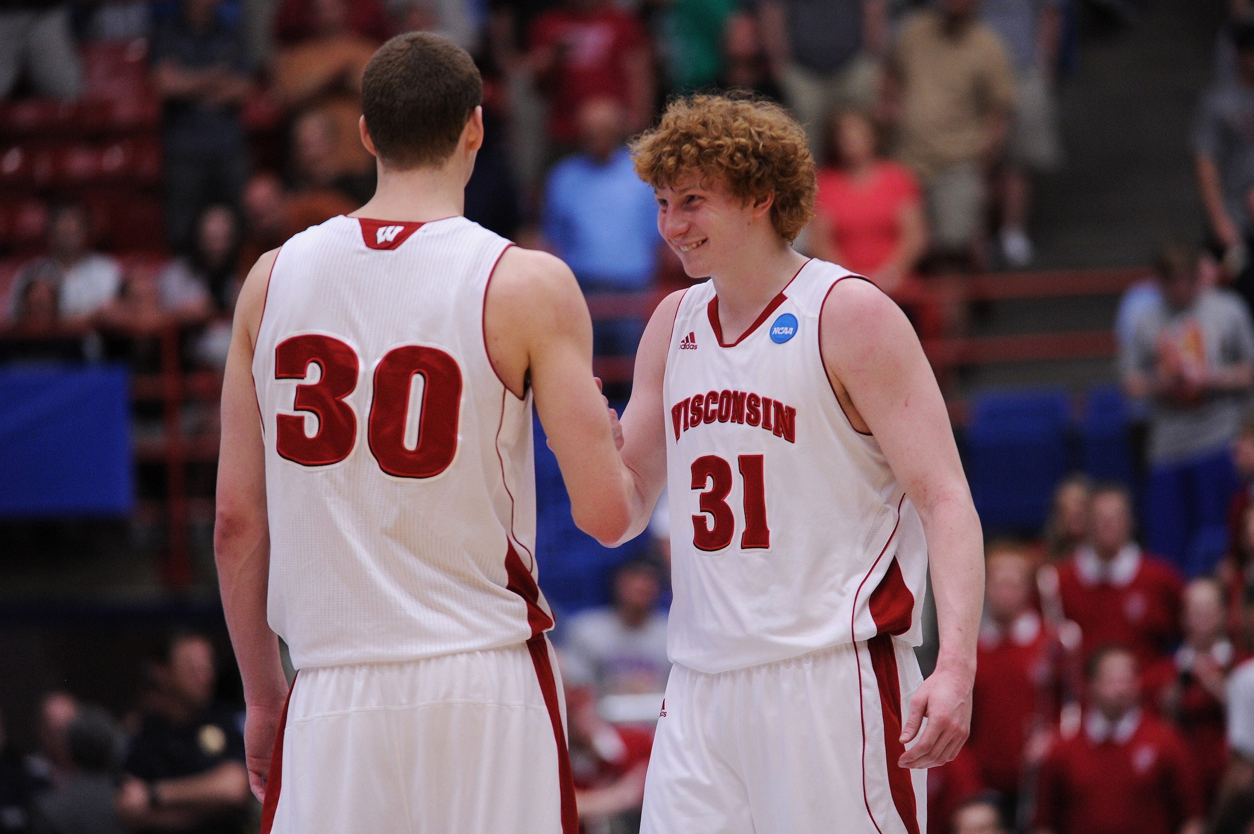 TUCSON, AZ - MARCH 19: Jon Leuer #30 and Mike Bruesewitz #31 of the Wisconsin Badgers celebrate during their 70 to 65 victory over the Kansas State Wildcats during the third round of the 2011 NCAA men's basketball tournament at McKale Center on March 19, TUCSON, AZ - MARCH 19: Jon Leuer #30 and Mike Bruesewitz #31 of the Wisconsin Badgers celebrate during their 70 to 65 victory over the Kansas State Wildcats during the third round of the 2011 NCAA men's basketball tournament at McKale Center on March 19,