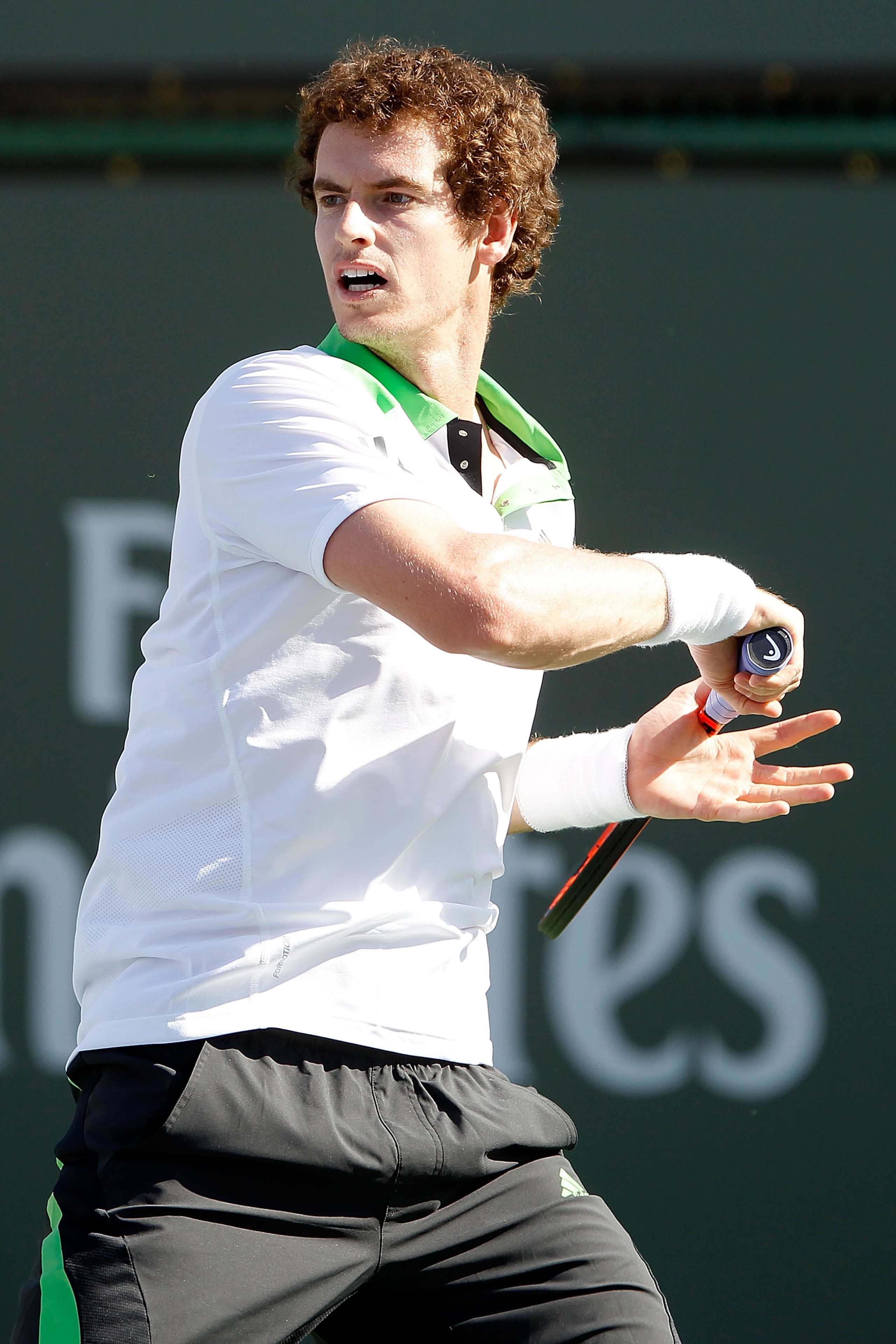 INDIAN WELLS, CA - MARCH 12:  Andy Murray of Great Britain returns a shot to Donald Yound during the BNP Paribas Open at the Indian Wells Tennis Garden on March 12, 2011 in Indian Wells, California.  (Photo by Matthew Stockman/Getty Images)