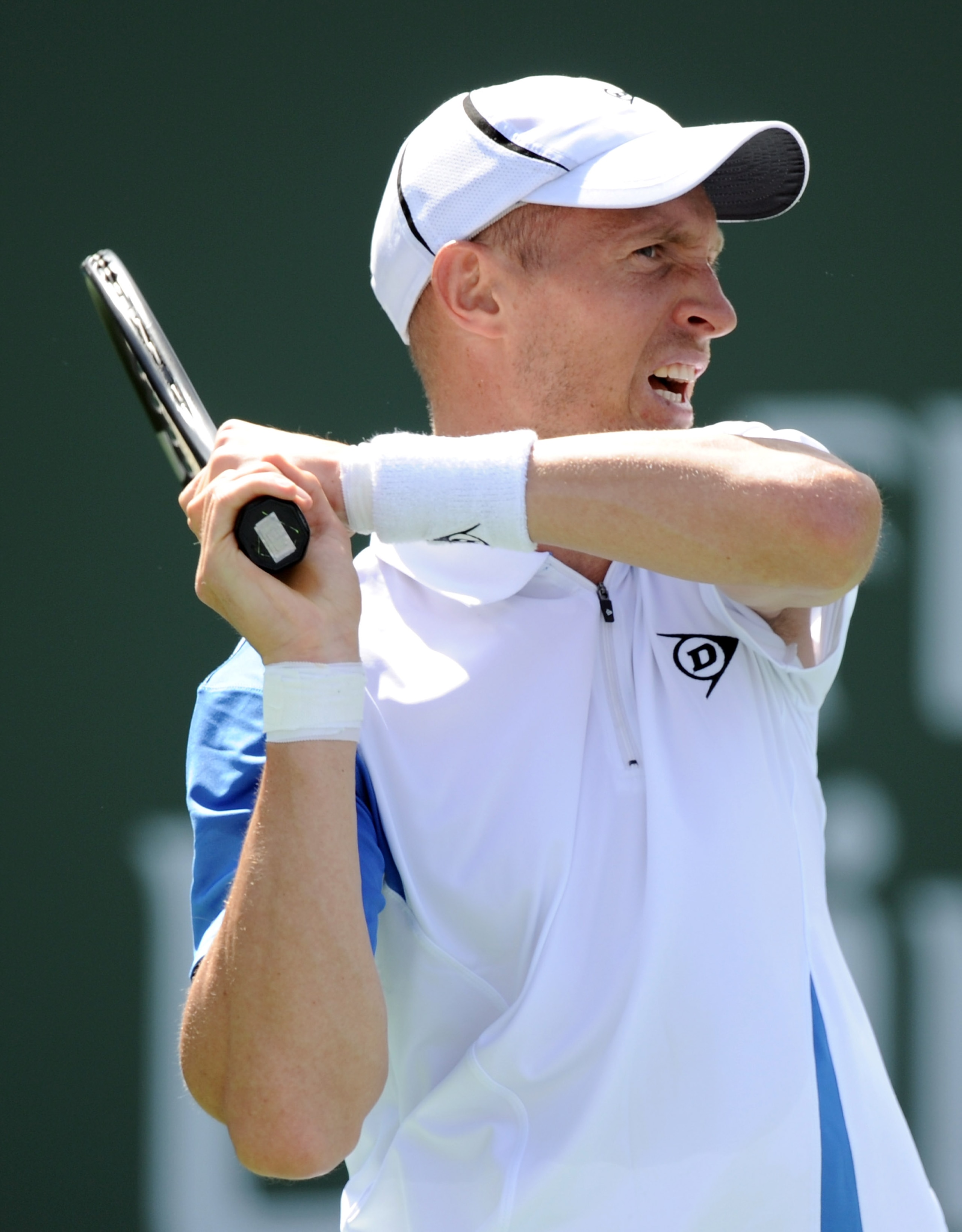 INDIAN WELLS, CA - MARCH 13:  Nikolay Davydenko of Russia watches his backhand in his match against Stanislas Wawrinka of Switzerland during the BNP Paribas Open at the Indian Wells Tennis Garden on March 13, 2011 in Indian Wells, California.  (Photo by H