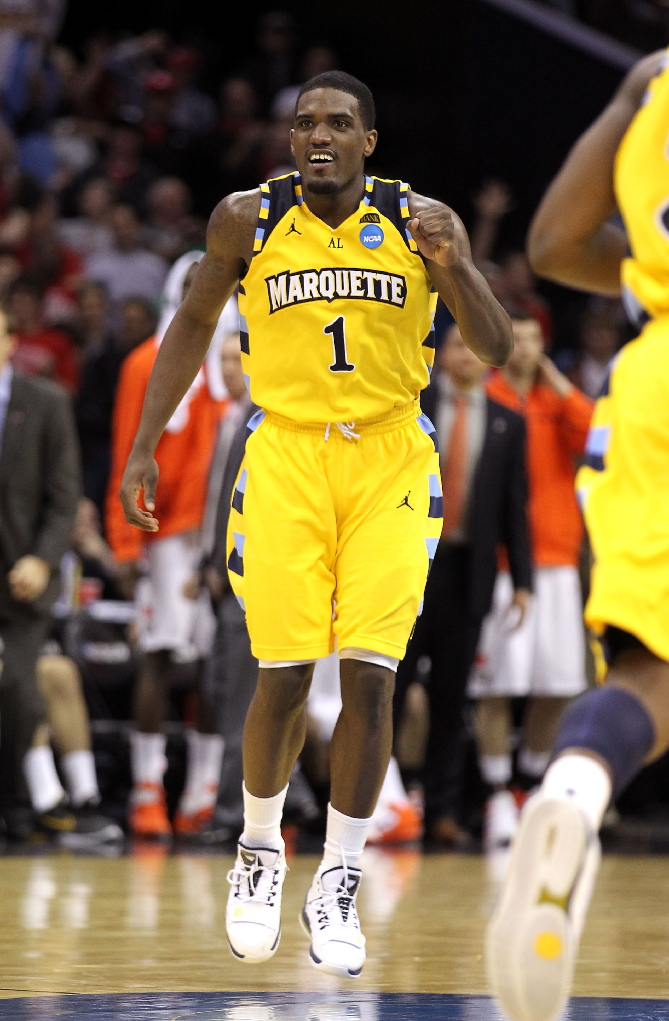 CLEVELAND, OH - MARCH 20: Darius Johnson-Odom #1 of the Marquette Golden Eagles pumps his fist late in the game against the Syracuse Orange during the third of the 2011 NCAA men's basketball tournament at Quicken Loans Arena on March 20, 2011 in Cleveland