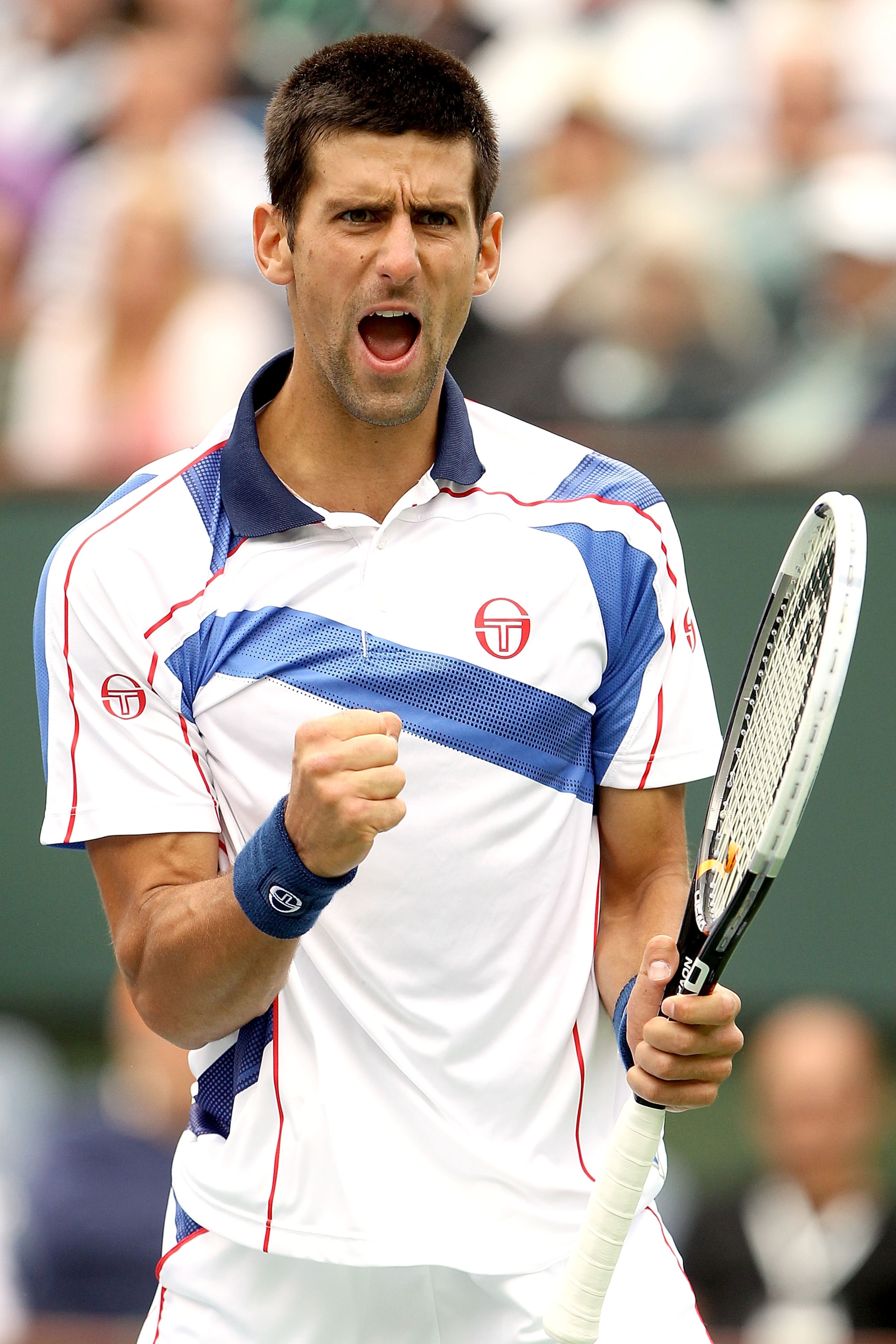 INDIAN WELLS, CA - MARCH 20:  Novak Djokovic of Serbia celebrates a point against Rafael Nadal of Spain during the final of the BNP Paribas Open at the Indian Wells Tennis Garden on March 20, 2011 in Indian Wells, California.  (Photo by Matthew Stockman/G