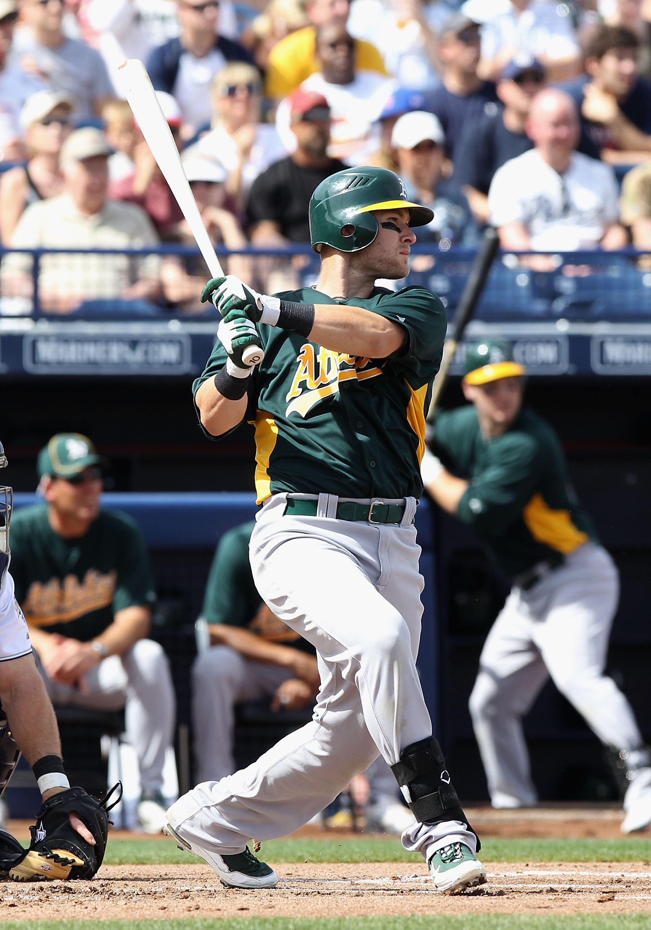PEORIA, AZ - MARCH 06:  Daric Barton #10 of the Oakland Athletics hits a single against the San Diego Padres during the first inning of the spring training game at Peoria Stadium on March 6, 2011 in Peoria, Arizona.  (Photo by Christian Petersen/Getty Ima
